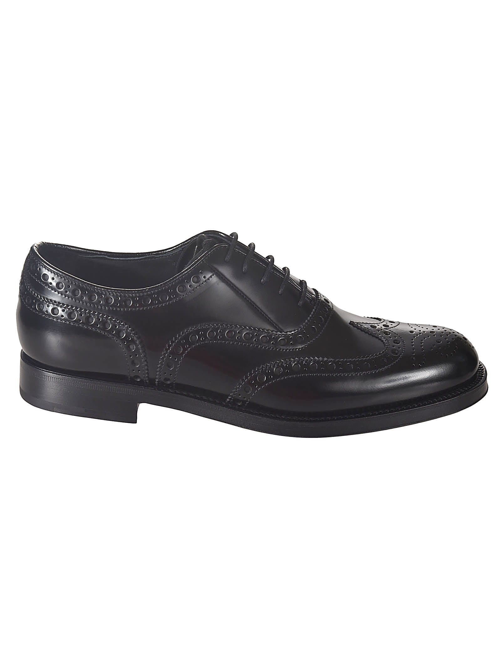 Prada Perforated Oxford Shoes In Black
