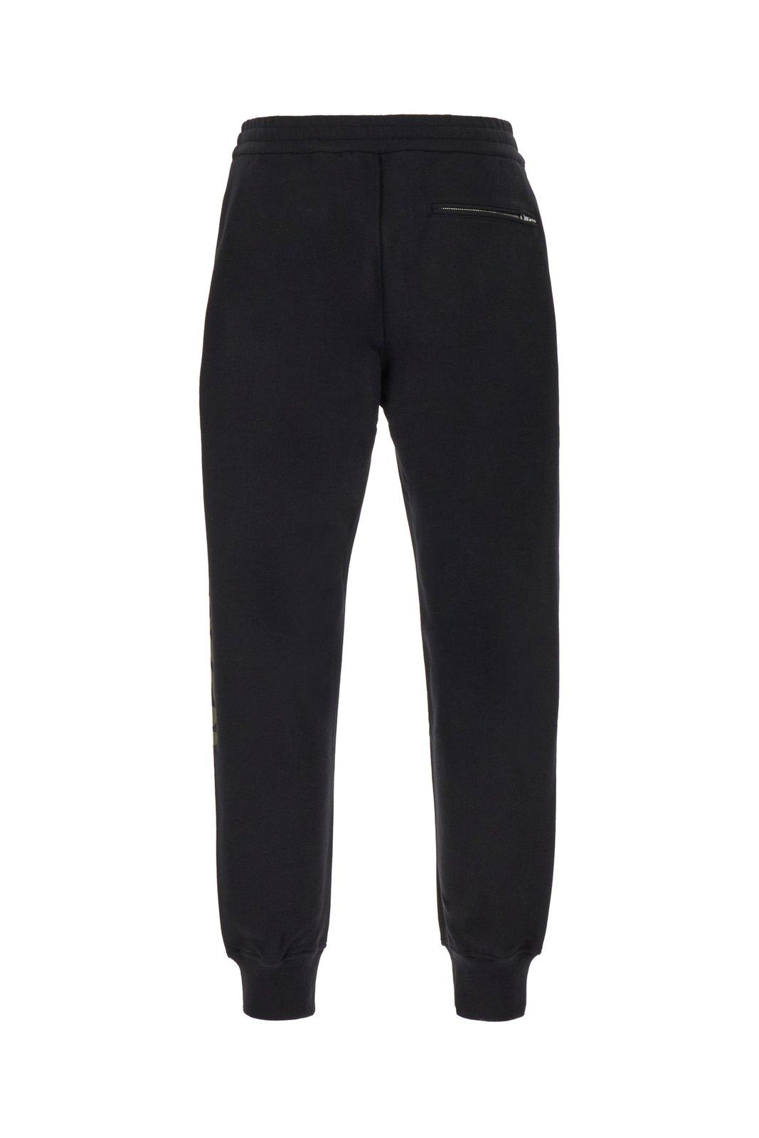 Alexander Mcqueen Graffiti Printed Track Trousers In Black