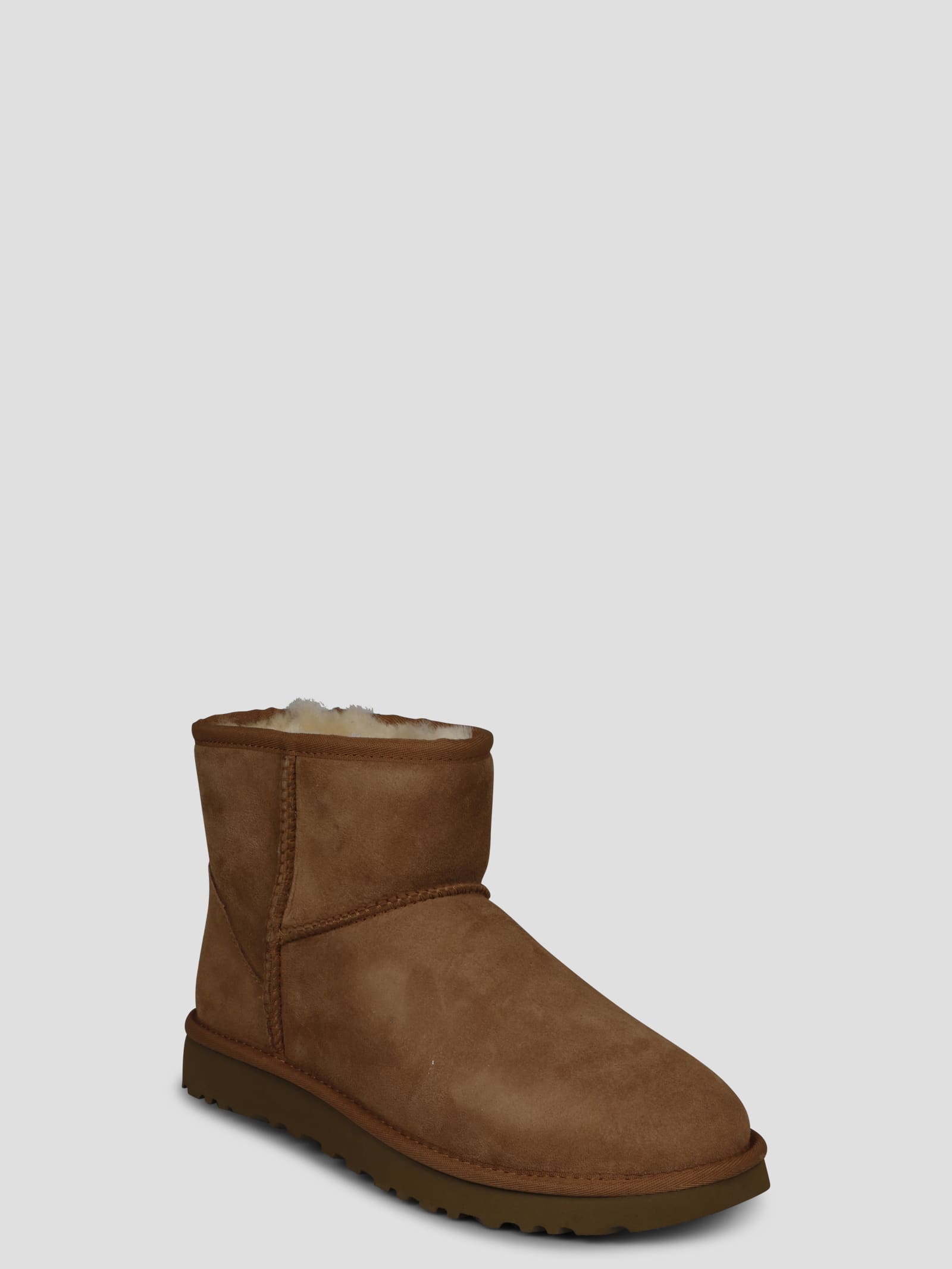 Shop Ugg Classic Mini Ii Boots In Brown