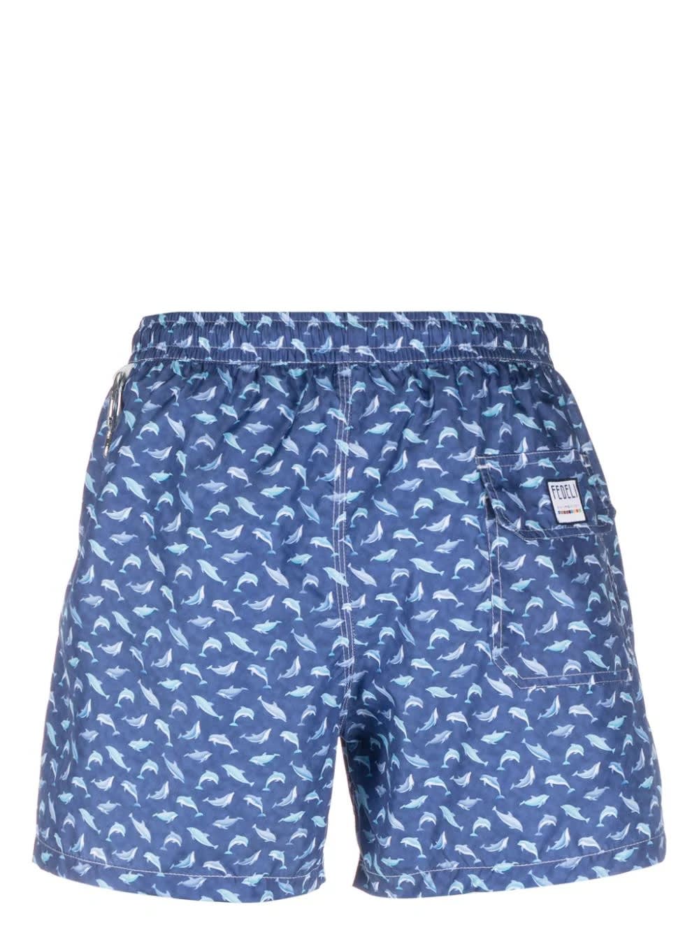 Shop Fedeli Blue Swim Shorts With Light Blue Dolphin Pattern