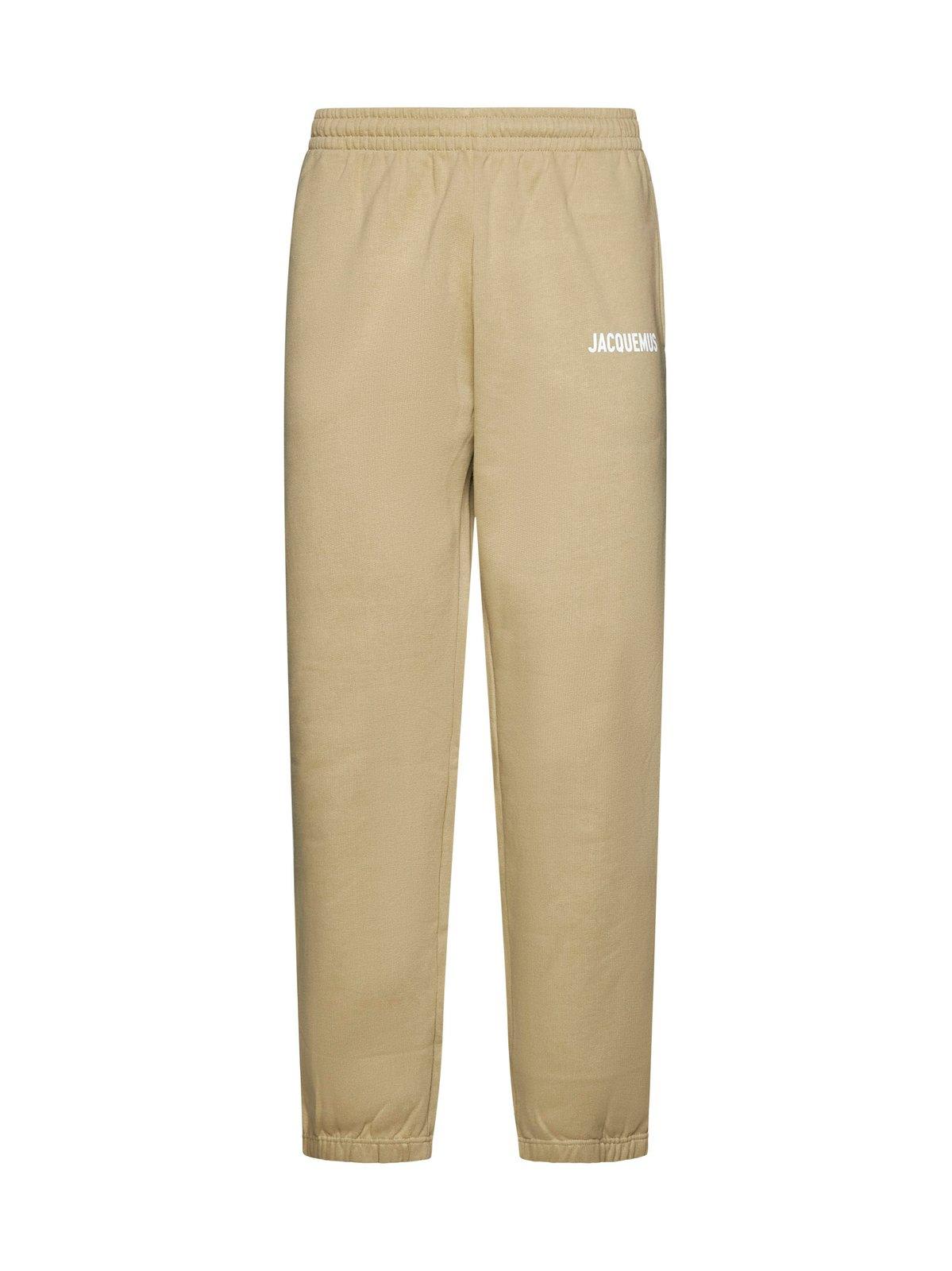 Shop Jacquemus Logo Printed Elasticated Waistband Track Pants In Brown