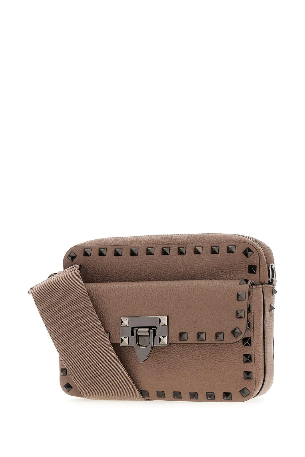 Shop Valentino Garavani Rockstud Zip-up Messenger Bag In Beige