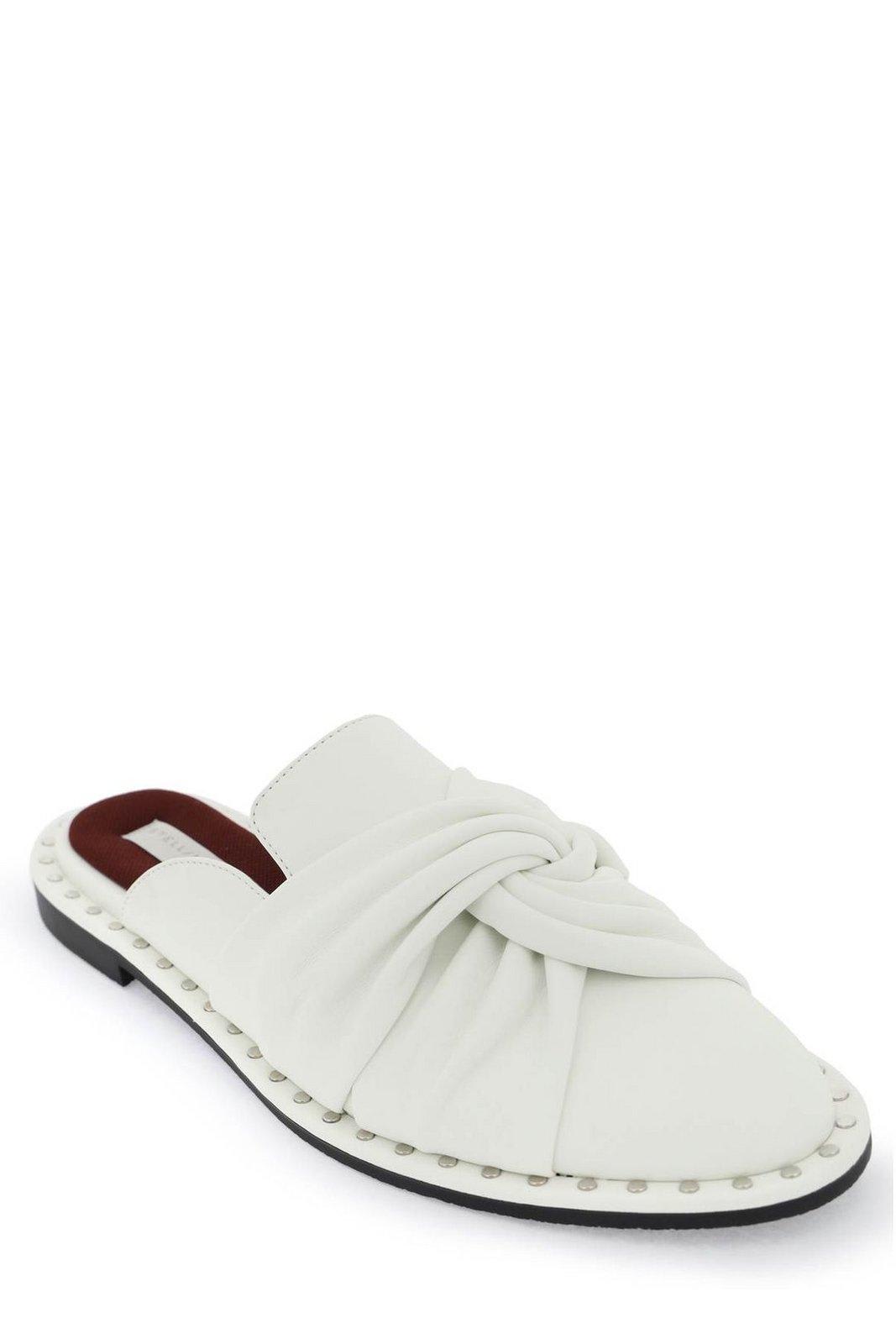 Shop Stella Mccartney Studded Twisted-detail Mules In White (white)