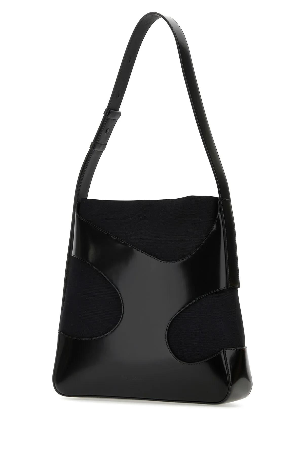 FERRAGAMO BLACK LEATHER AND CANVAS CUT OUT SHOULDER BAG