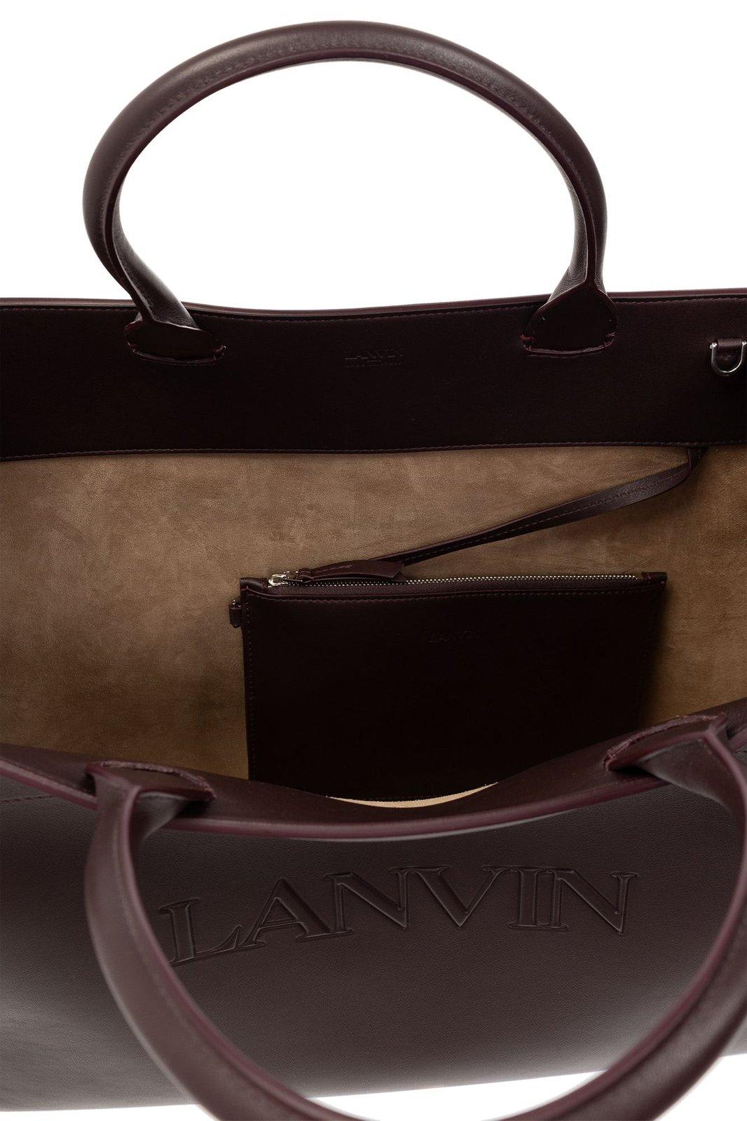 Shop Lanvin Logo Embossed Top Handle Bag In Amarena