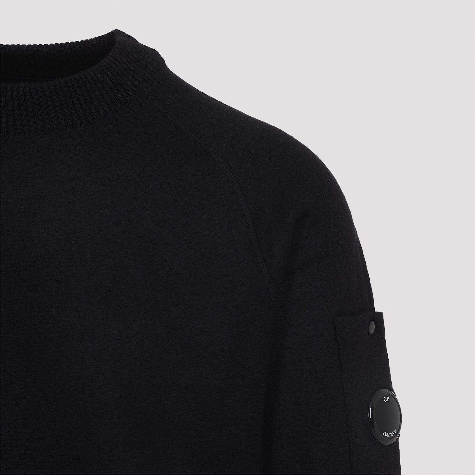 C.p. Company Ribbed Pullover With Sleeve Pocket And Cuffs In Black