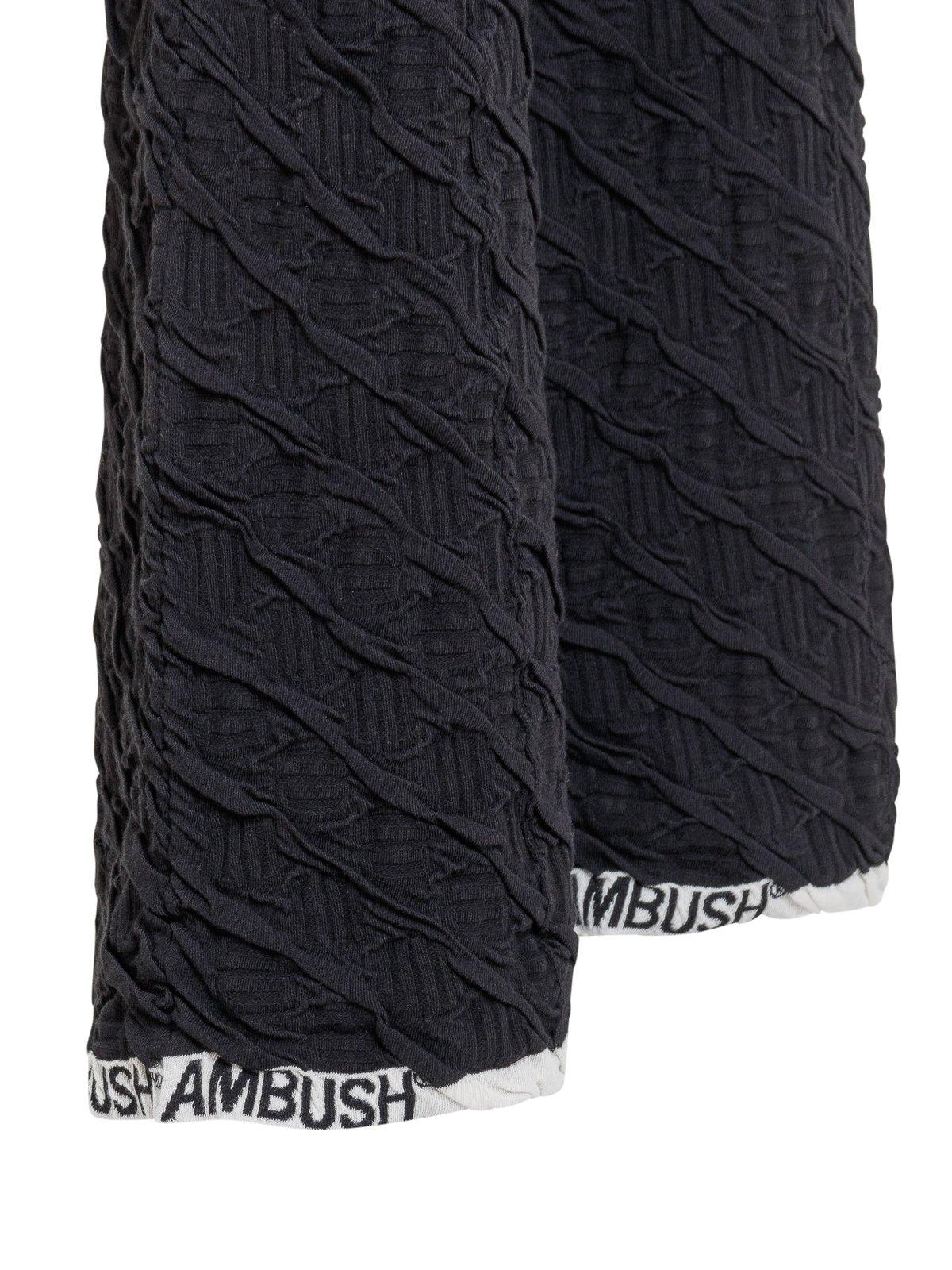 Shop Ambush High-waisted Monogram Flared Trousers In Black