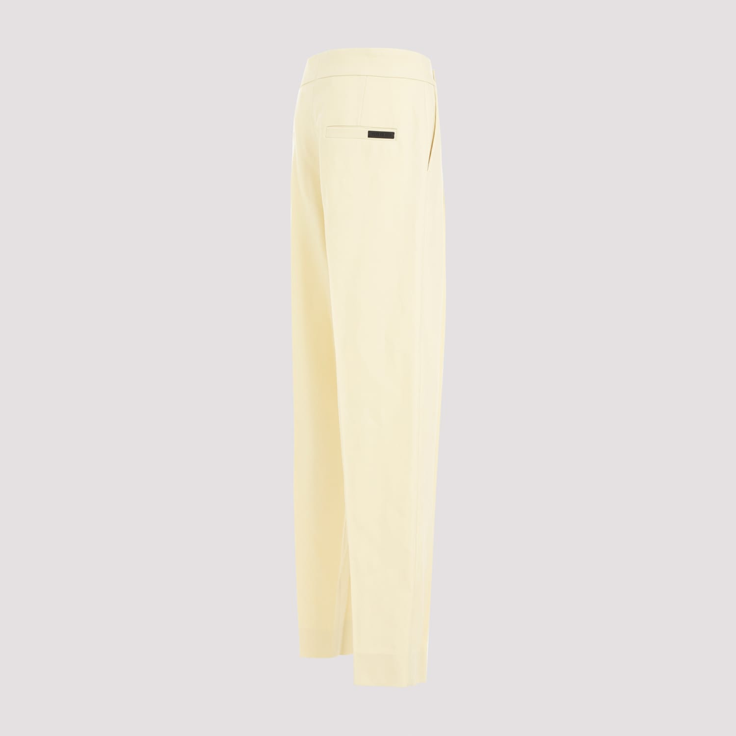 Shop Fear Of God Single Pleat Tapered Trousers In Lemon Cream