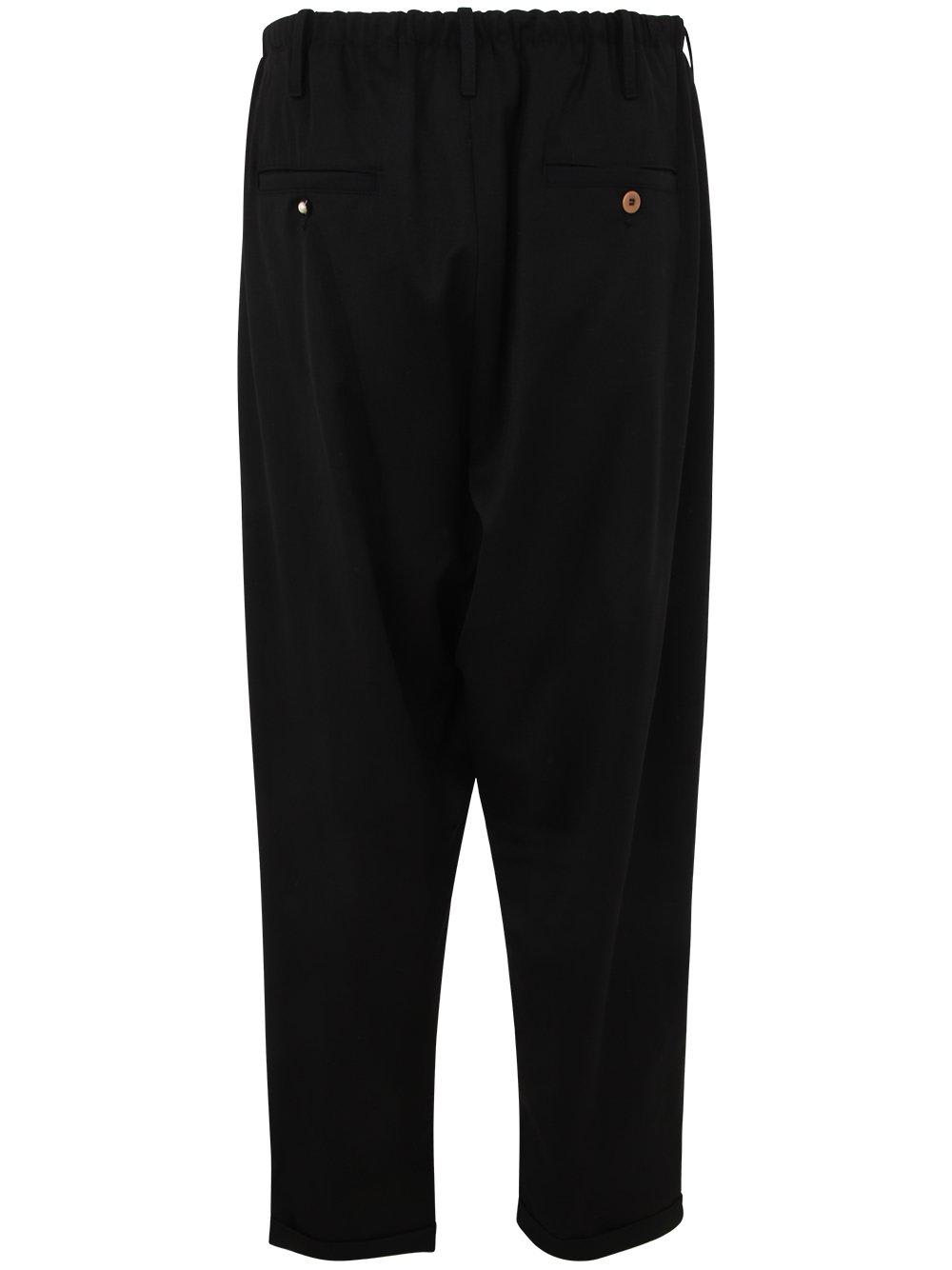 Shop Magliano Low-rise Wide-leg Trousers In Black