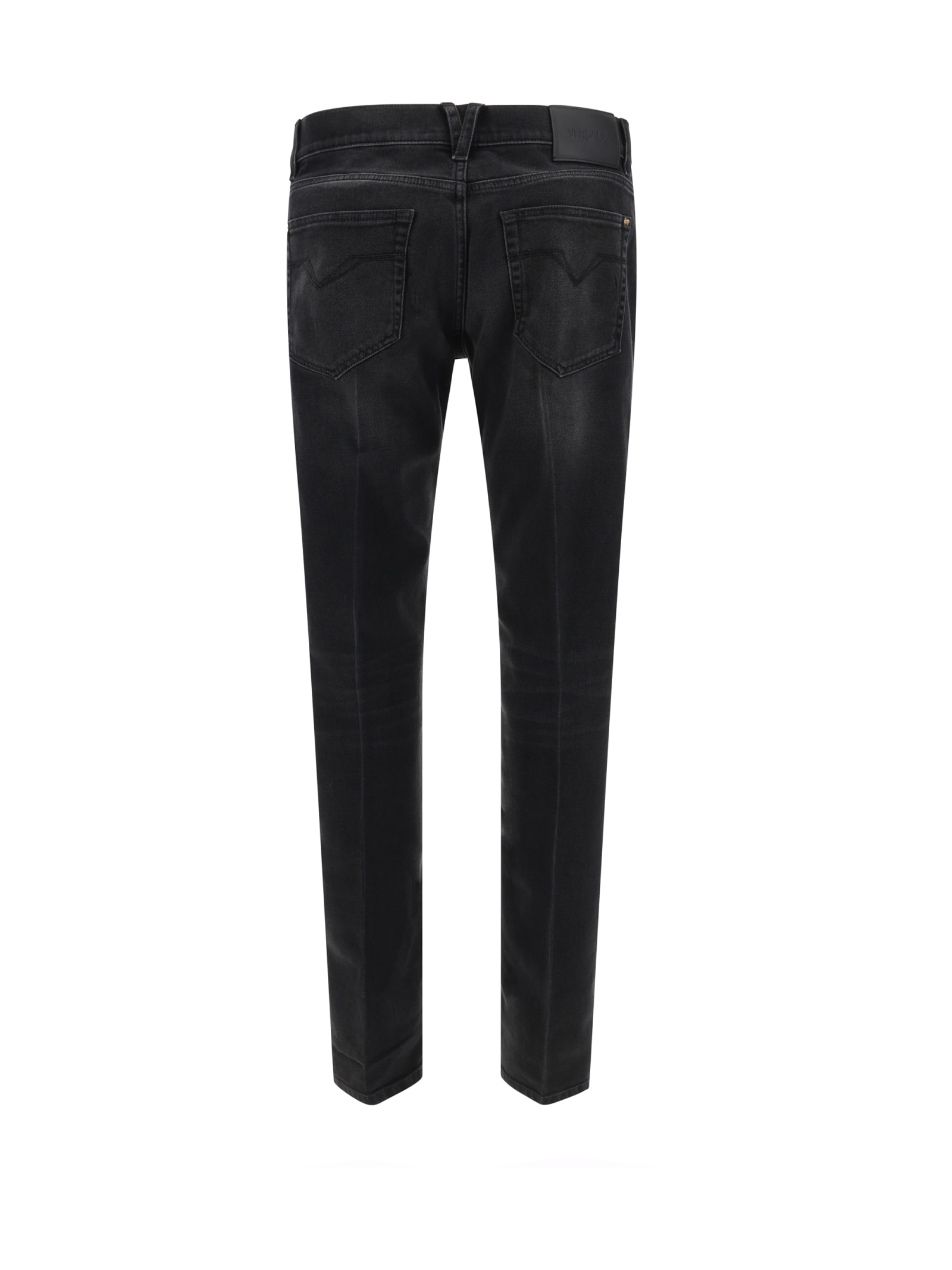 Shop Versace Pants In Faded Washed Black (black)