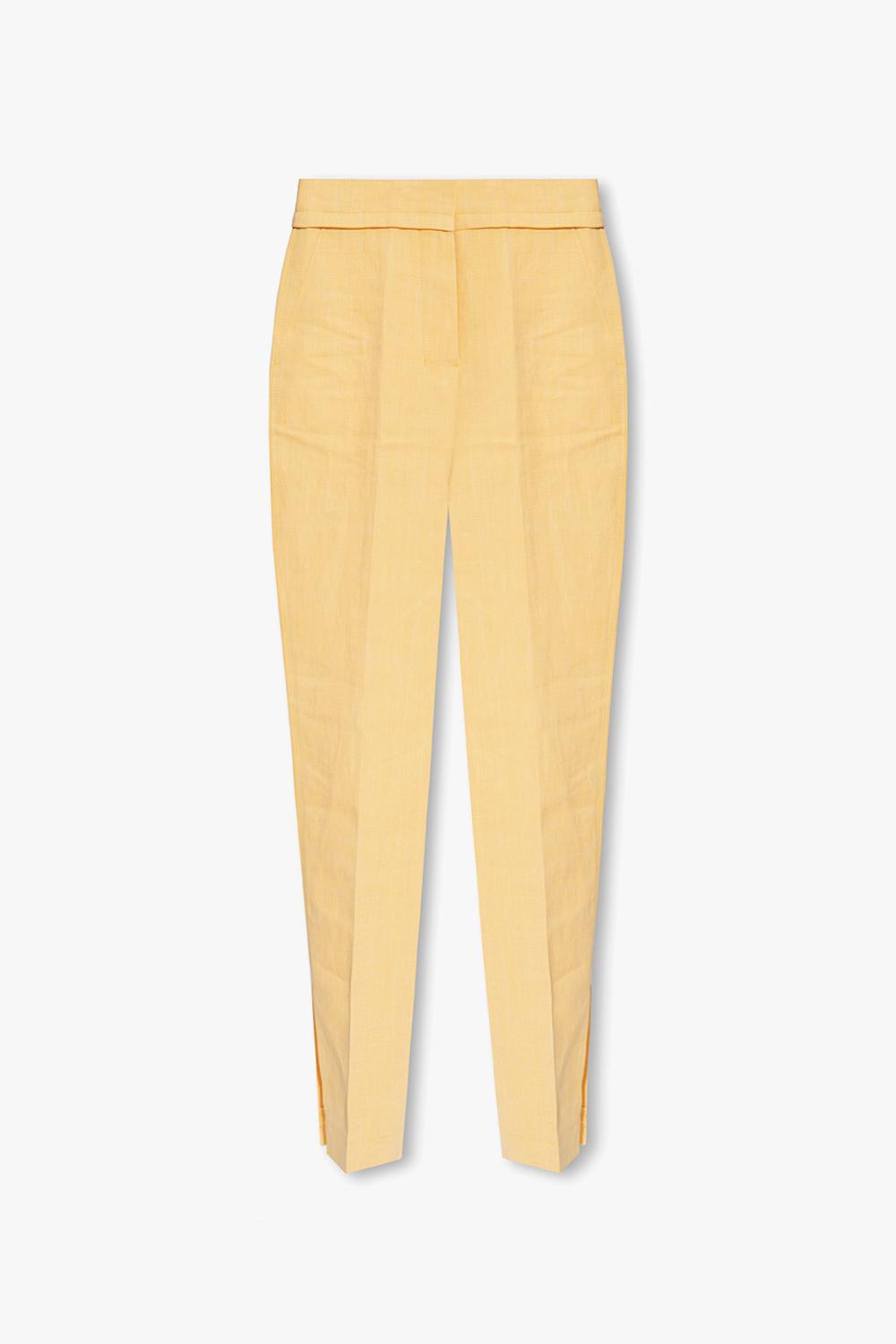 Shop Jacquemus Tibau Pleat-front Trousers In Yellow