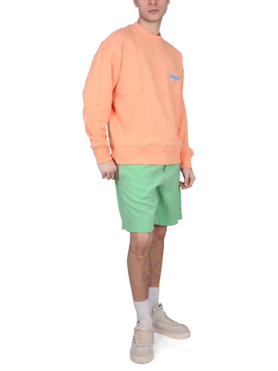 Msgm Graphic Print Cross-neck Sweatshirt With Ribbed Trim In Orange