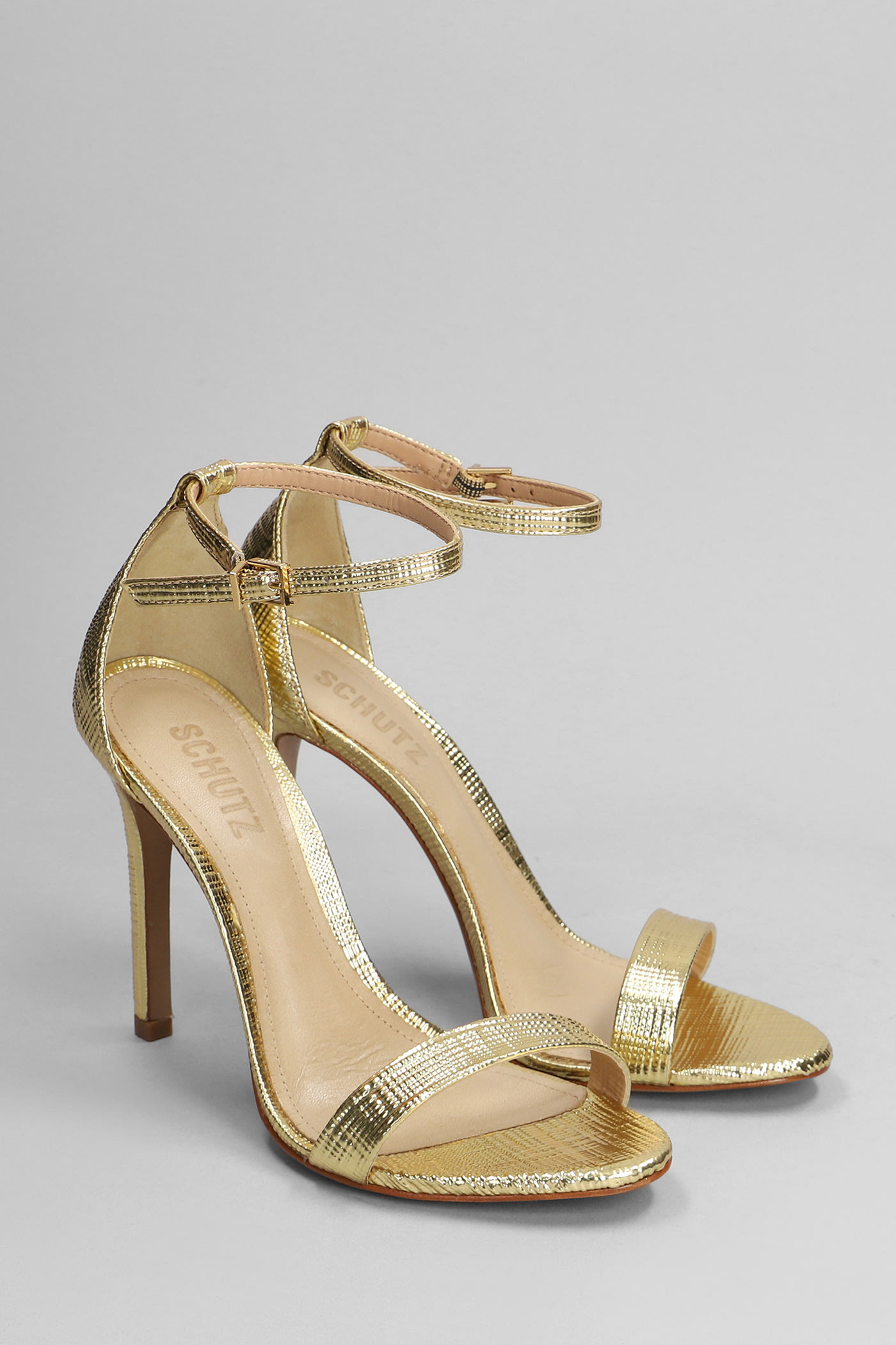 Shop Schutz Sandals In Gold Leather