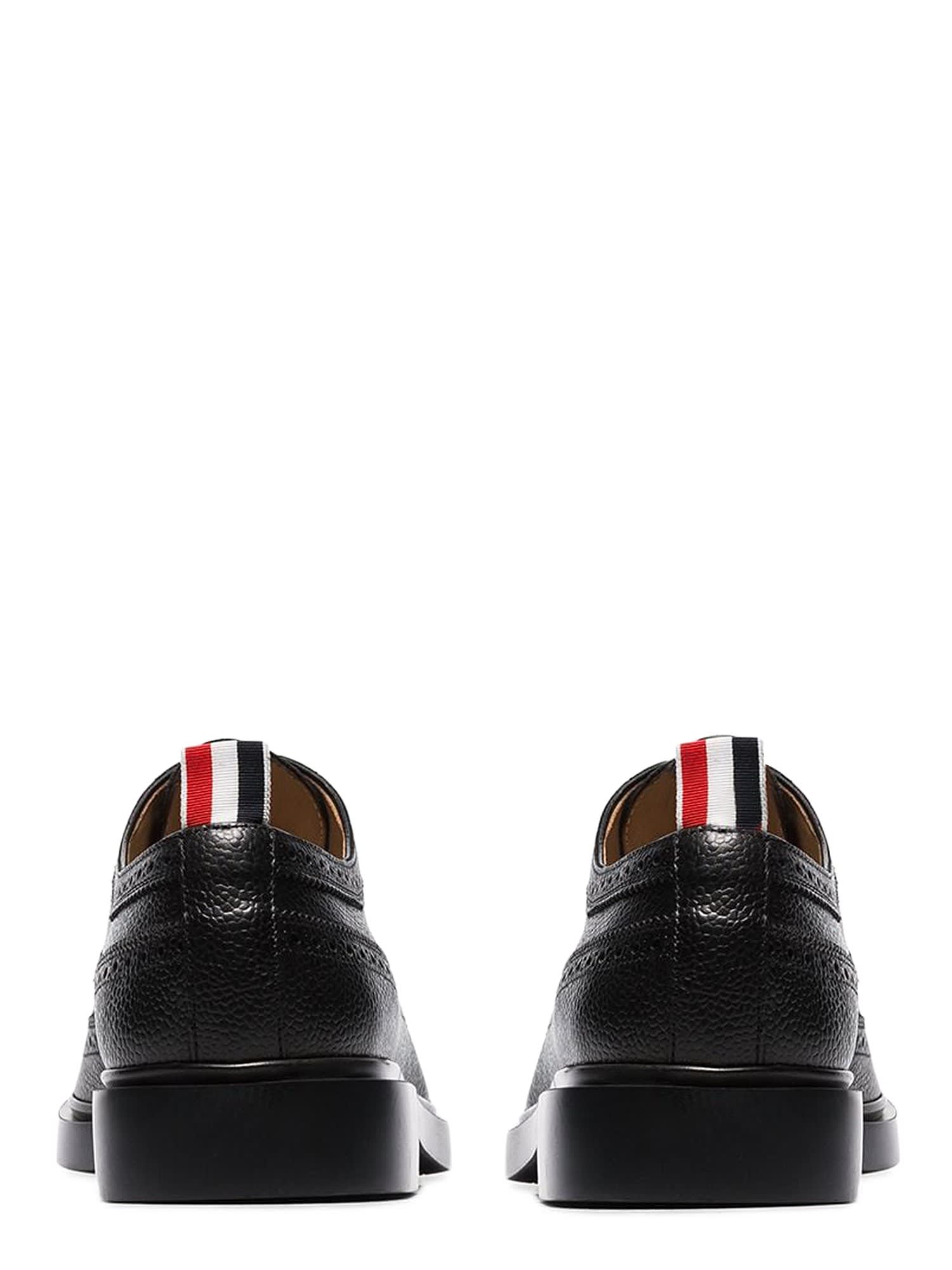 Shop Thom Browne Lace-up Long Wing Brogue In Black