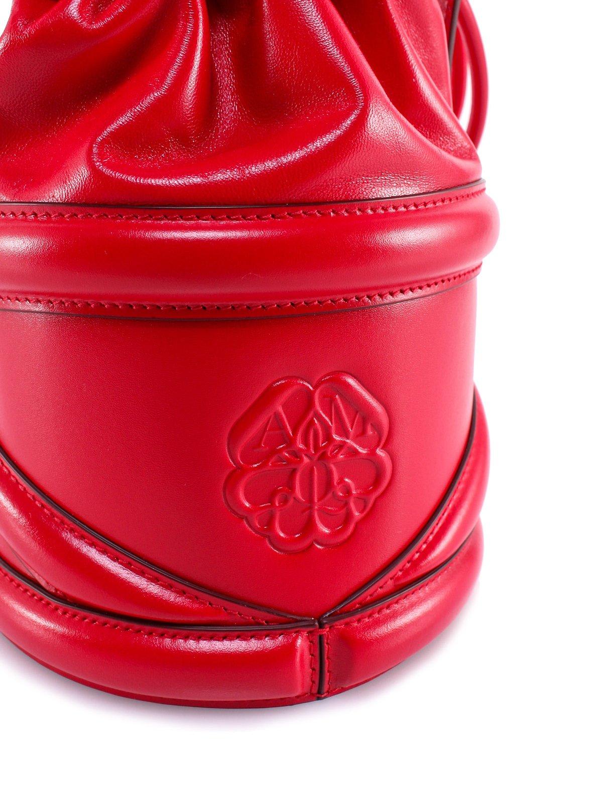 Shop Alexander Mcqueen Logo Detailed Drawstring Bucket Bag In Red