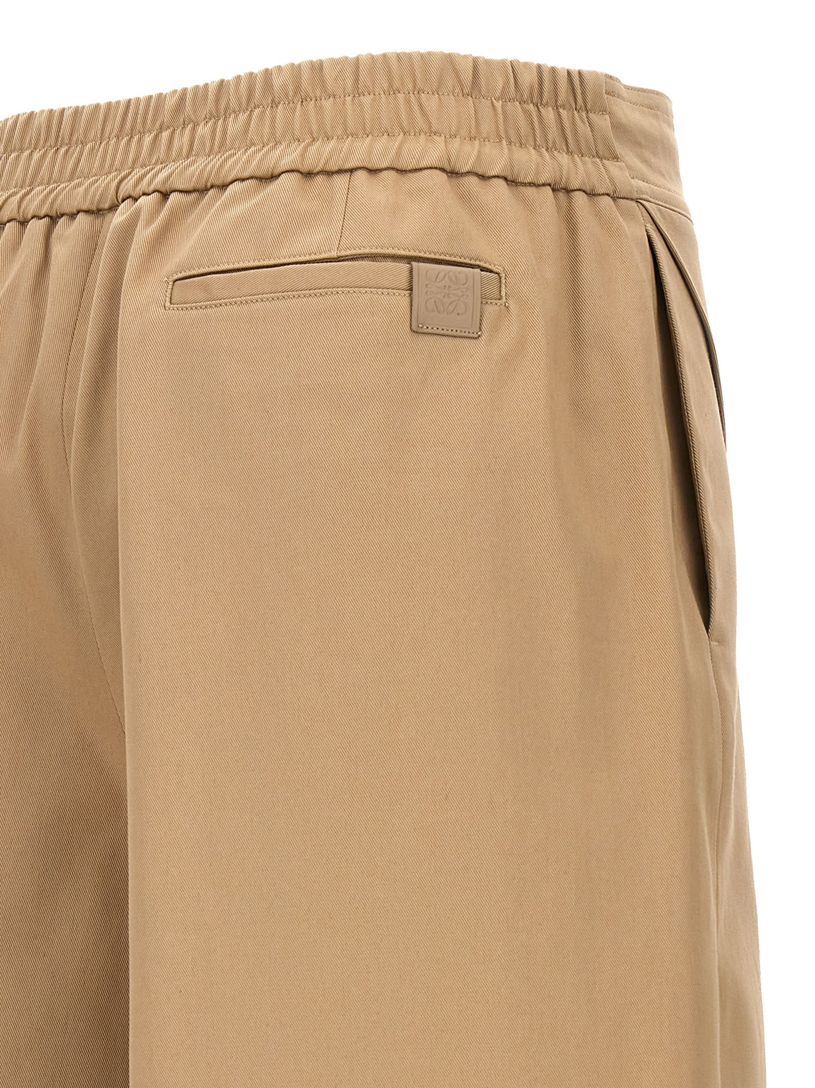 Shop Loewe Turned-up Crop Trousers In Beige