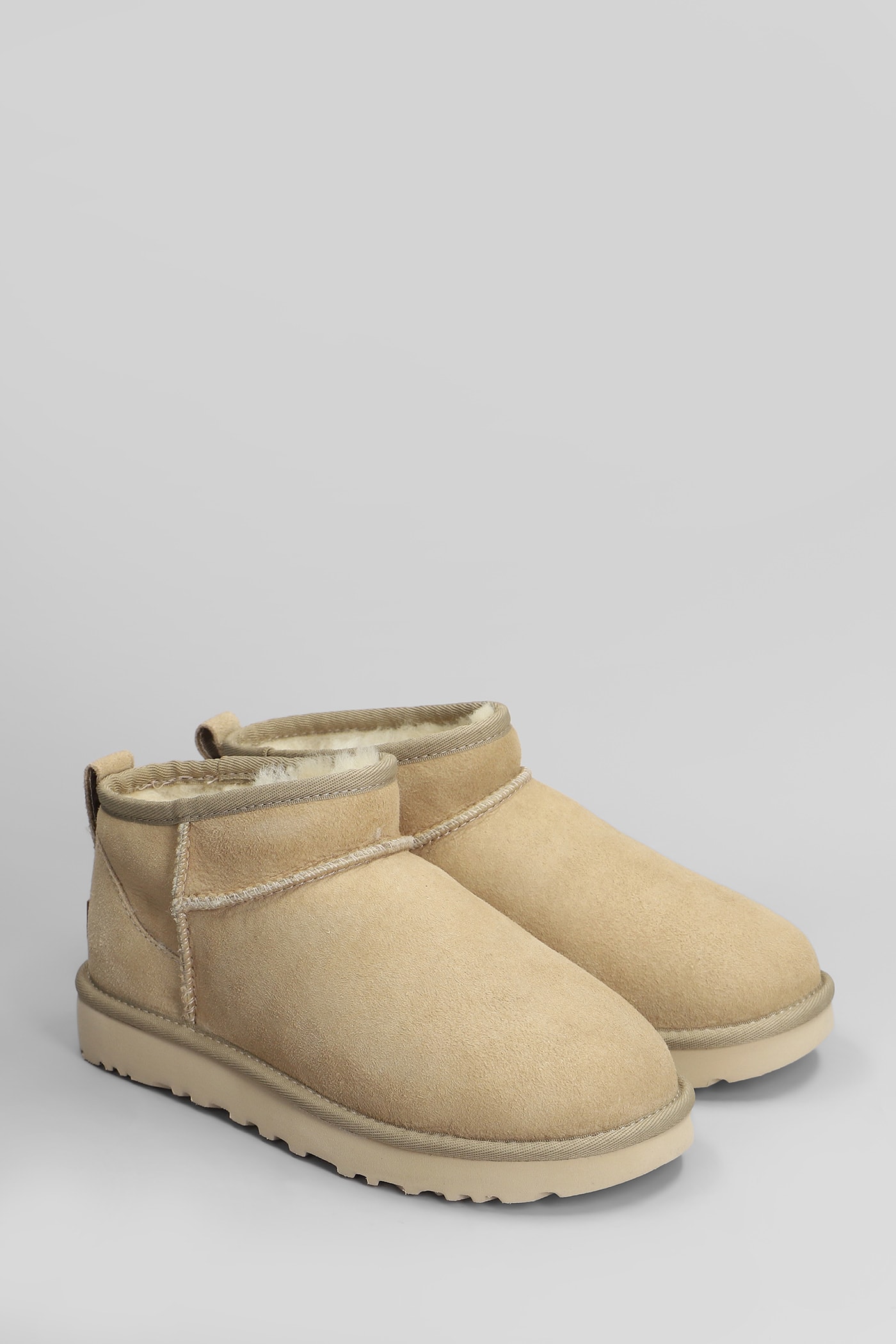 UGG CLASSIC ULTRA MINI LOW HEELS ANKLE BOOTS IN BEIGE SUEDE