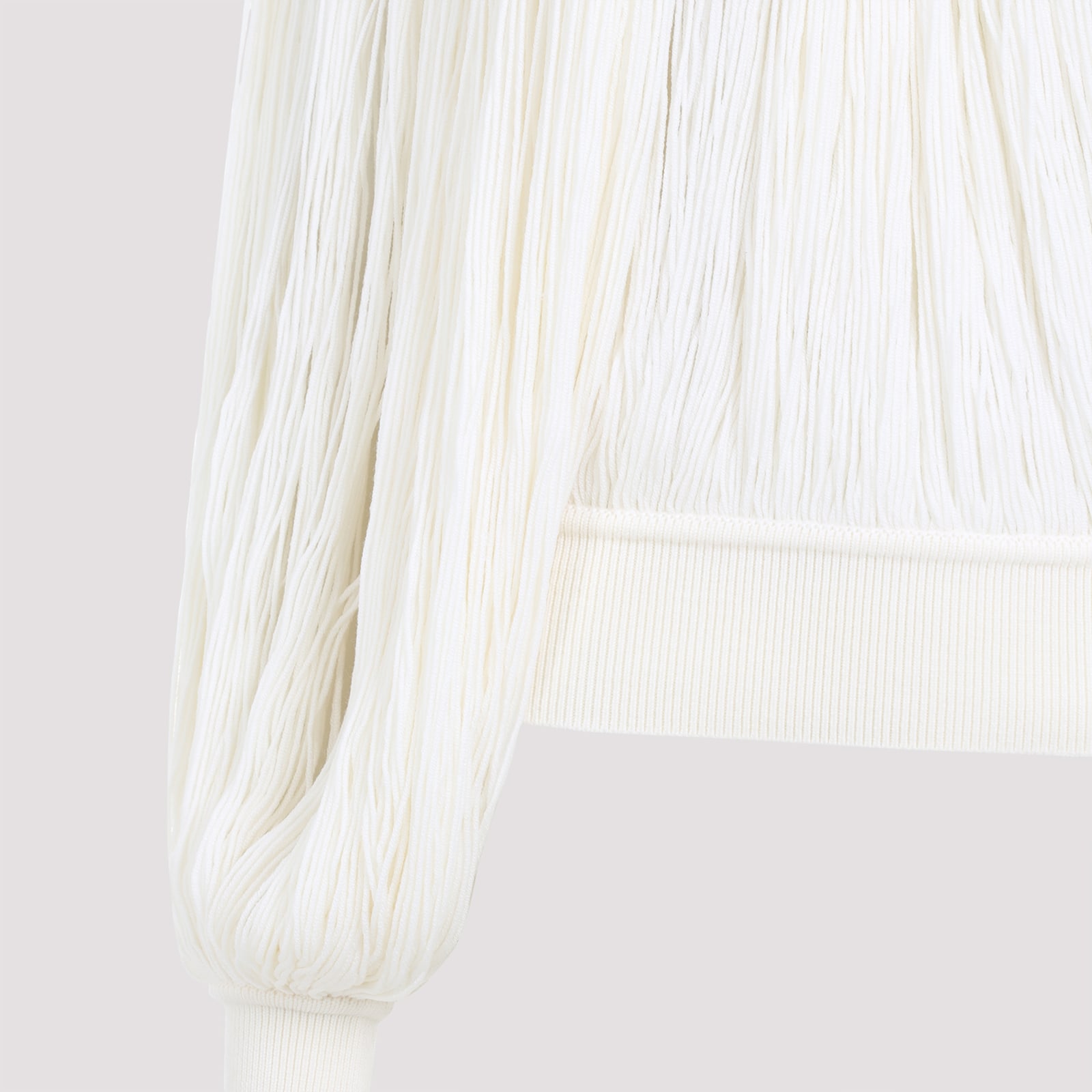 Alaïa Fringed Yarn Knit Merino Wool Top In Blanc Casse