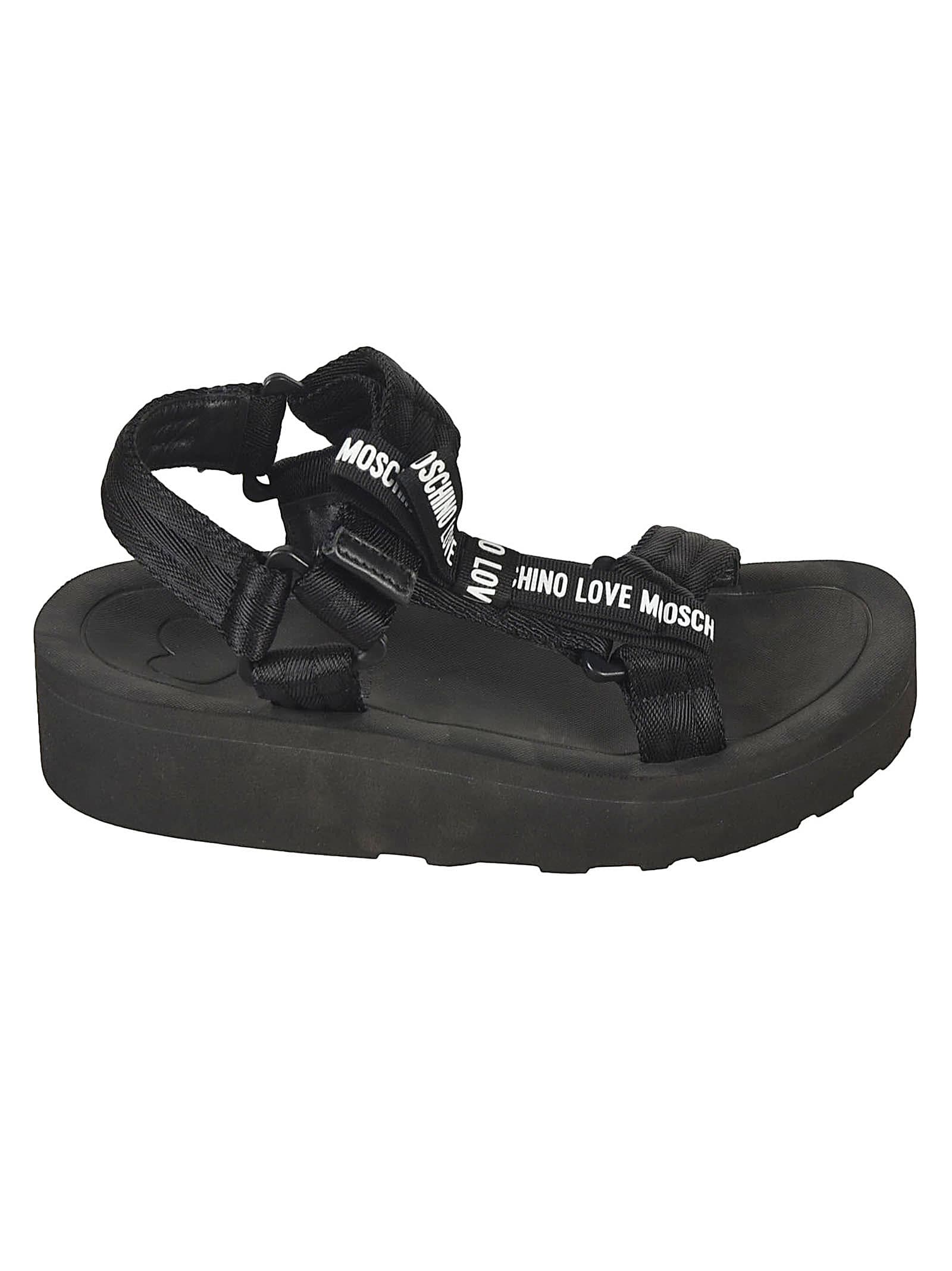 Shop Love Moschino Logo Strap Sandals In Black