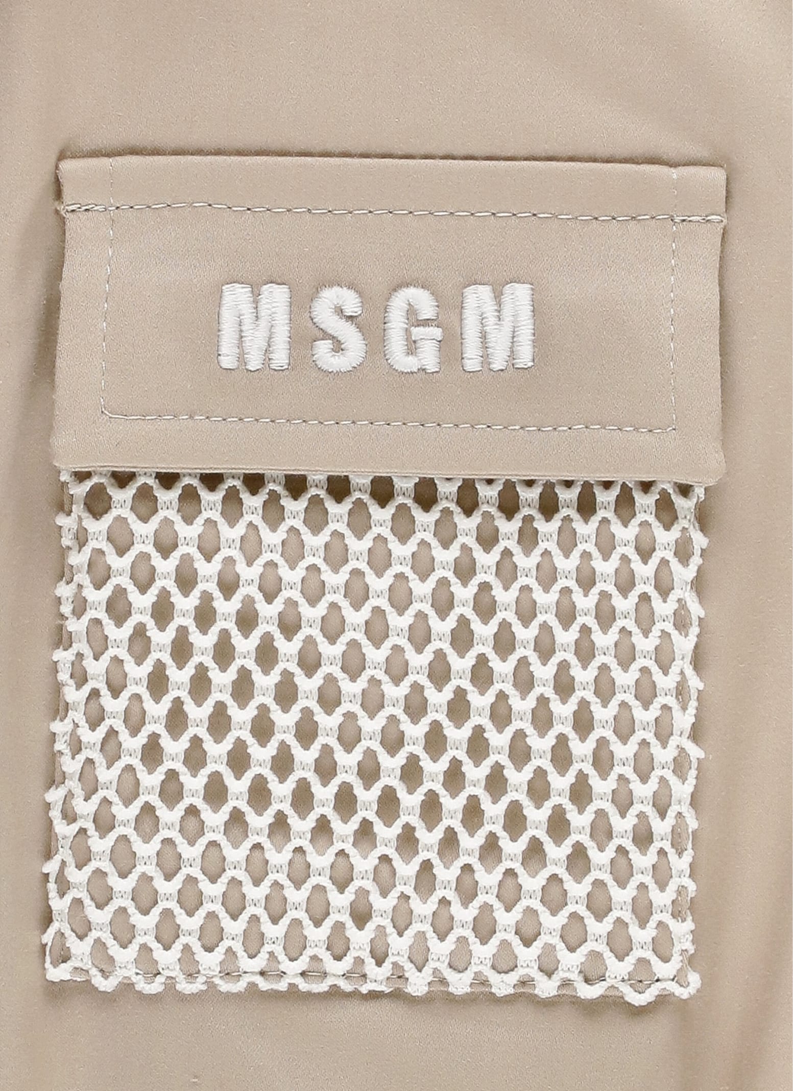 Shop Msgm Logoed Jumpsuit In Beige