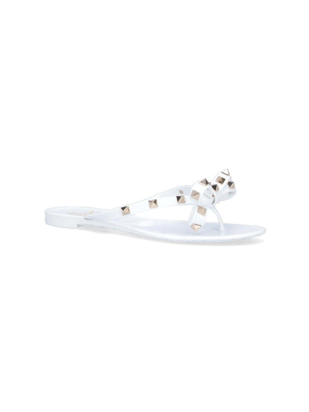 Shop Valentino Thong Sandals Rockstud In White