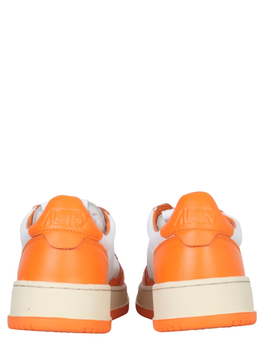 Shop Autry Medalist Low Sneaker In Orange