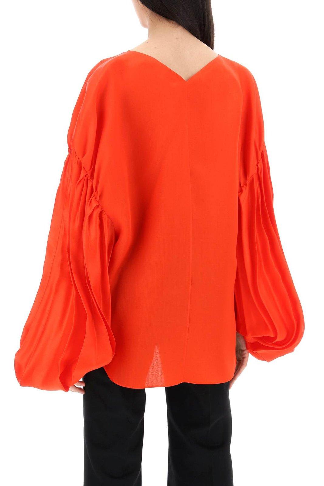 Shop Khaite The Quico Puff-sleeved Blouse In Red