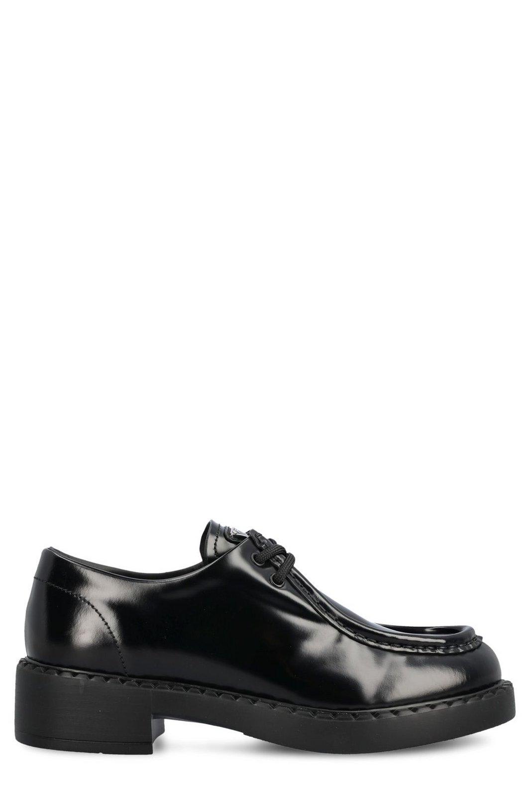 Shop Prada Triangle Logo Plaque Lace-up Shoes In Nero