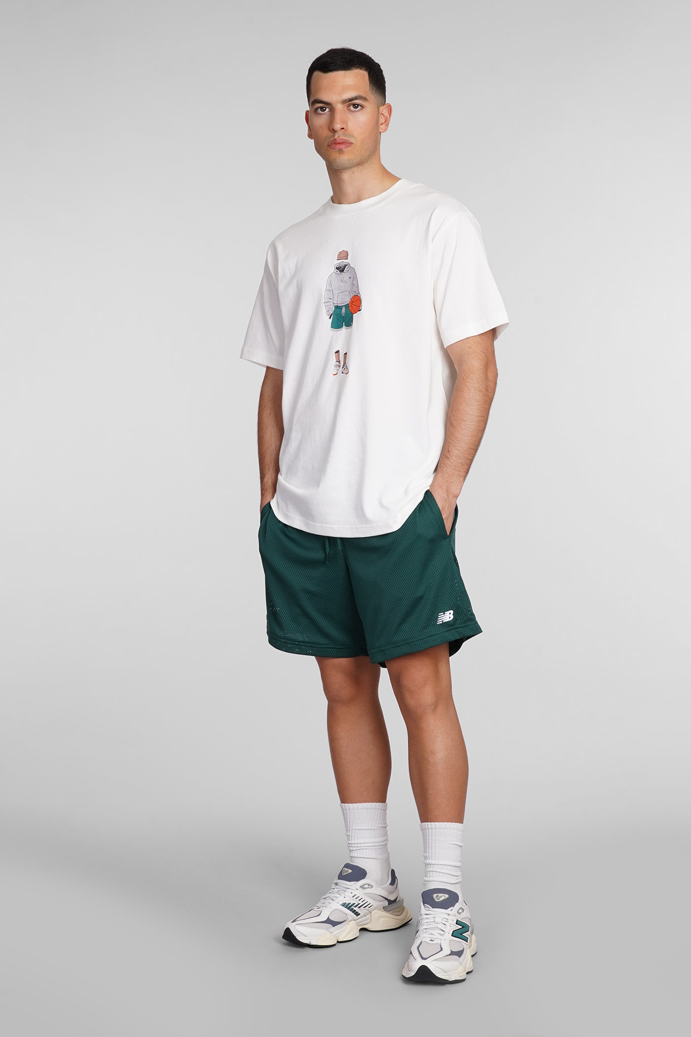 NEW BALANCE SHORTS IN GREEN POLYESTER