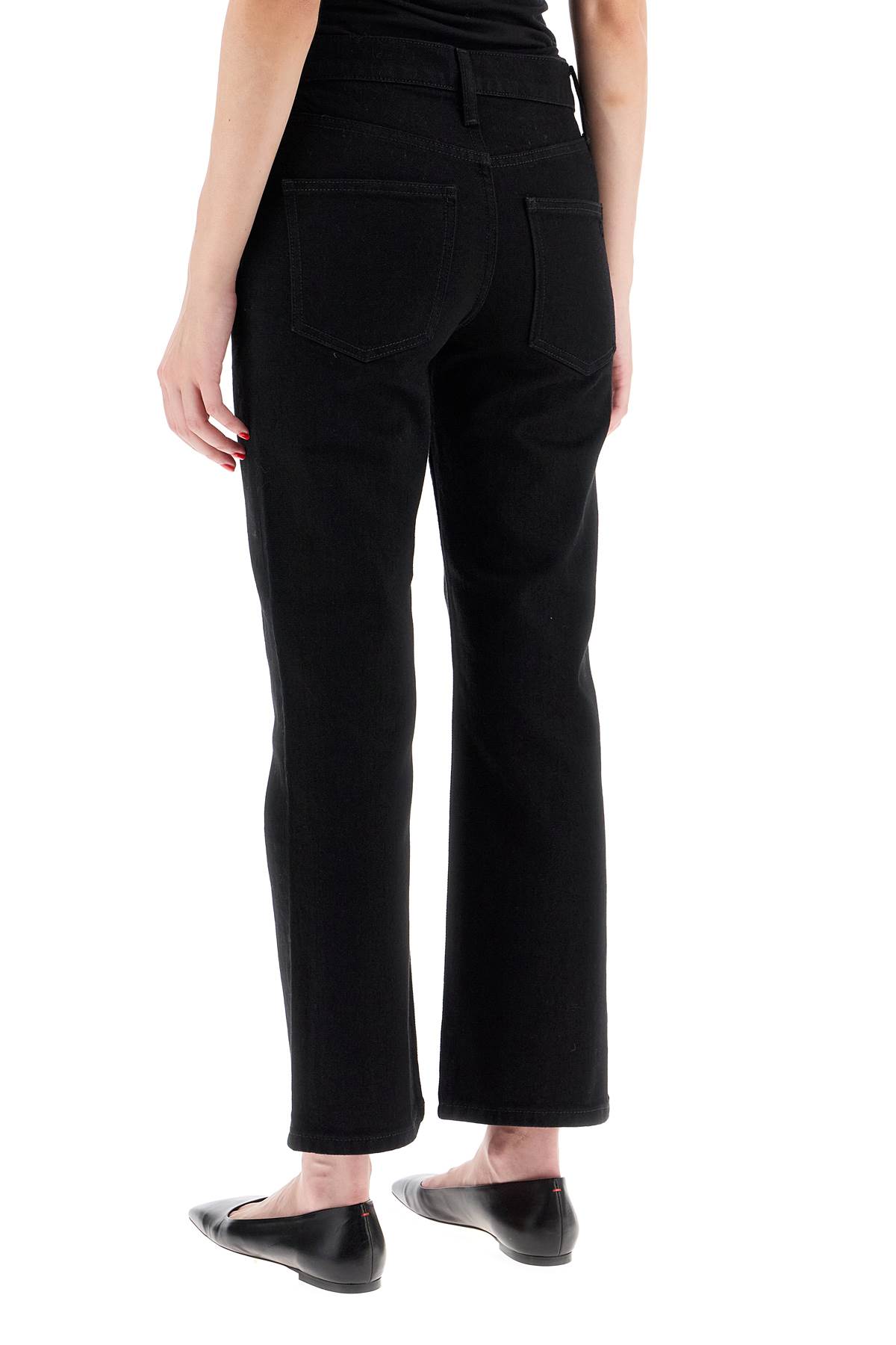 Shop Tory Burch Low-waisted Kick Flare Jeans In Black Rinse Wash (black)