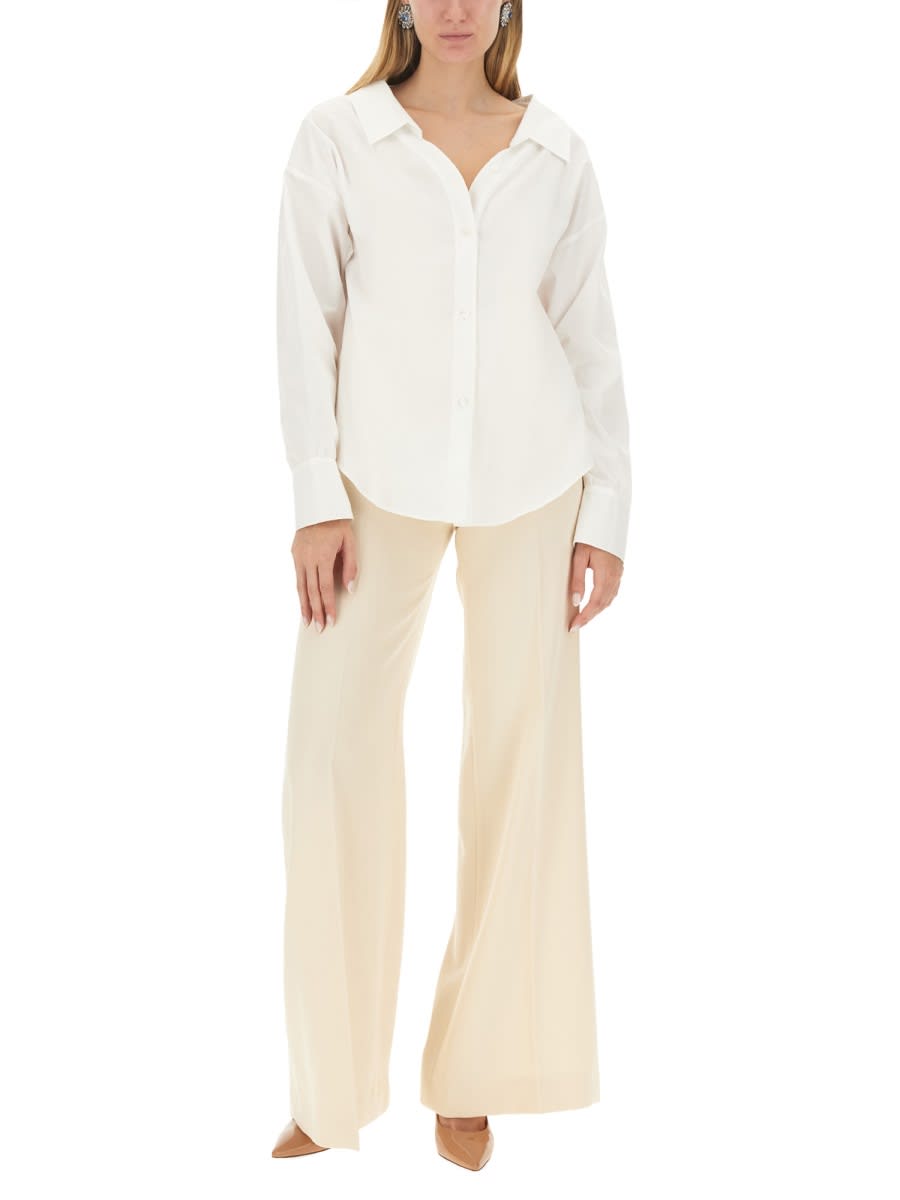 Shop Moschino Wide Leg Pants In Ivory