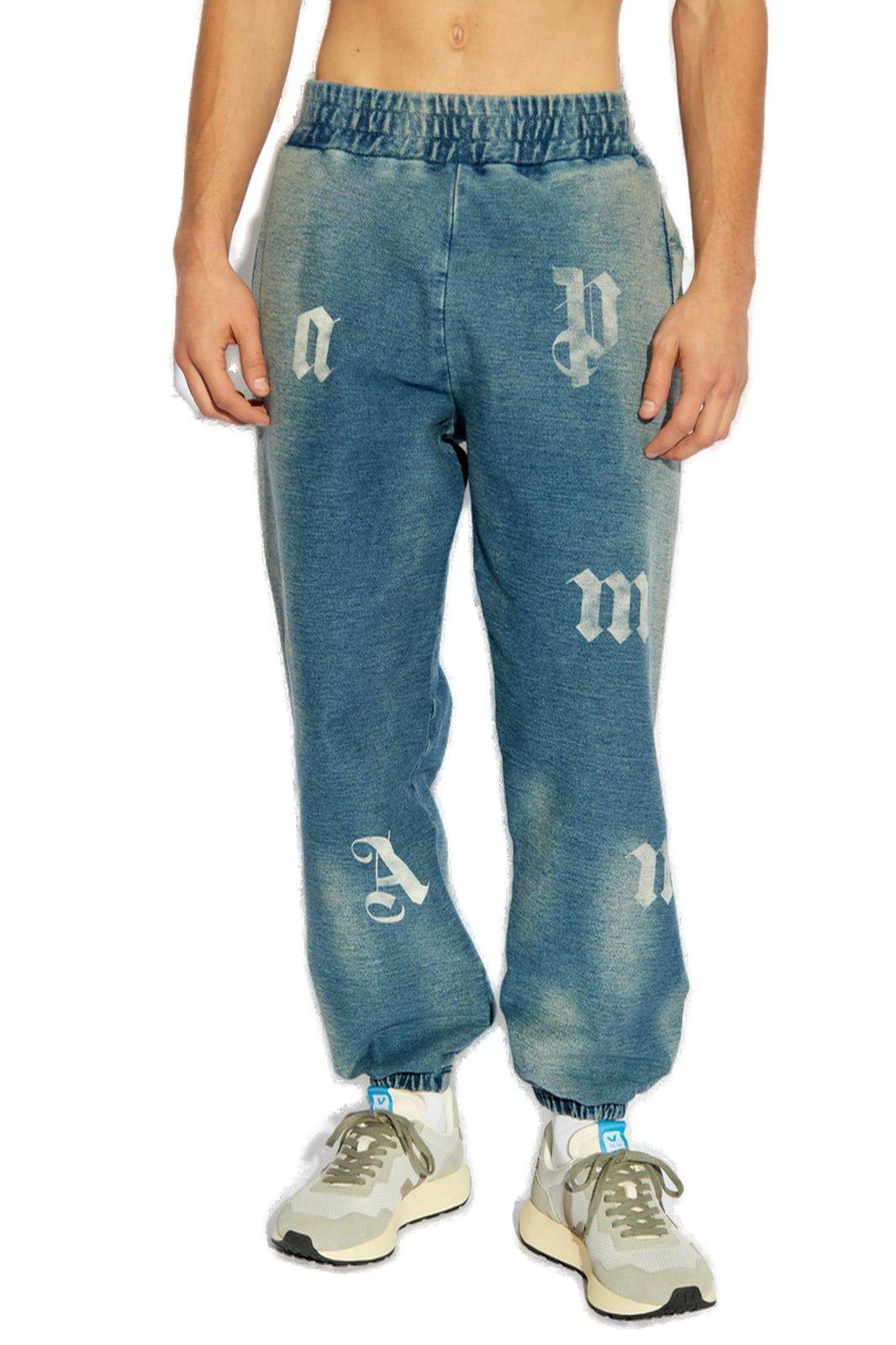 Shop Palm Angels Letter Printed Elastic Waistband Jeans In Blu