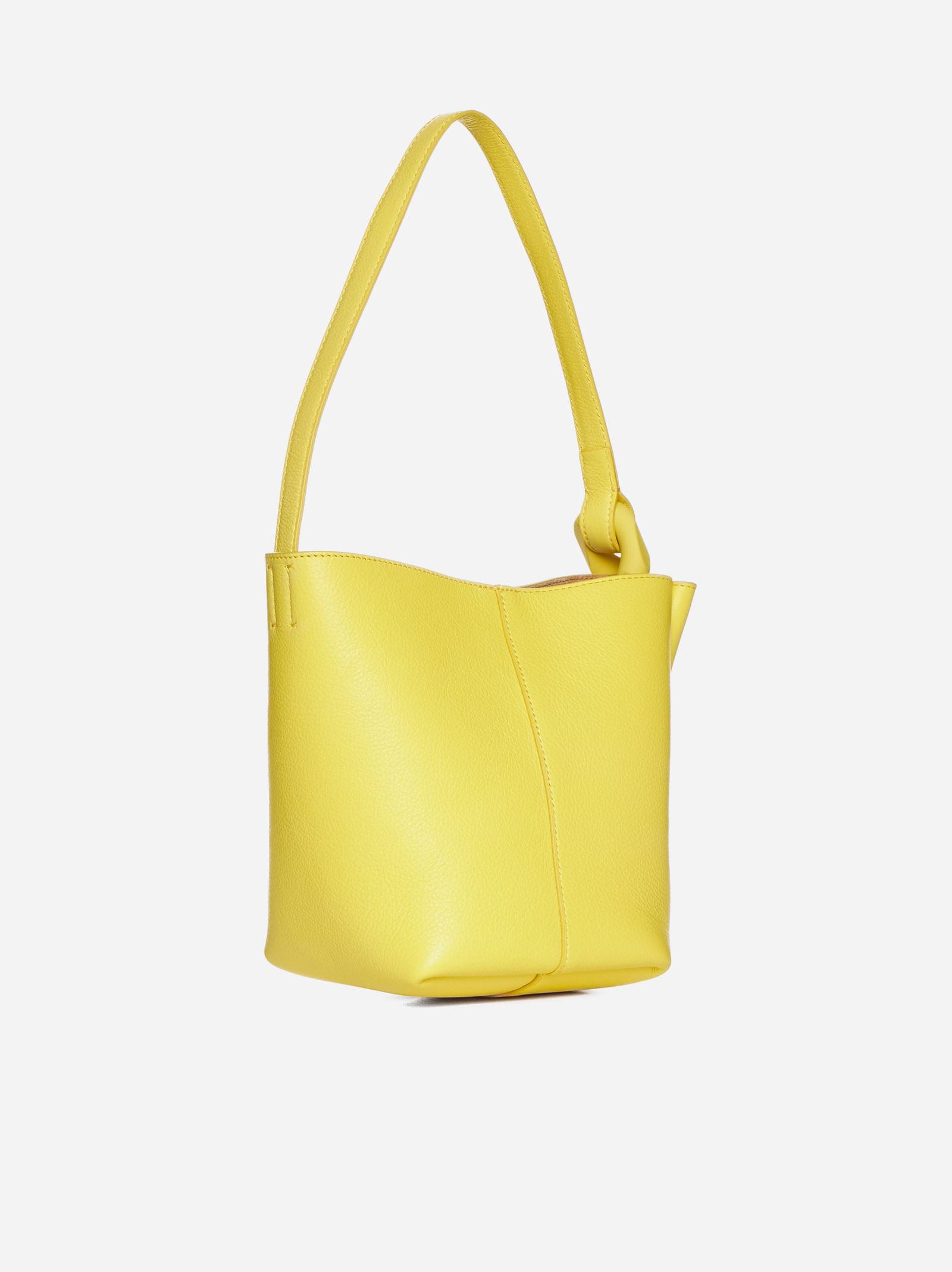 Shop Jw Anderson Corner Leather Small Bucket Bag In Yellow