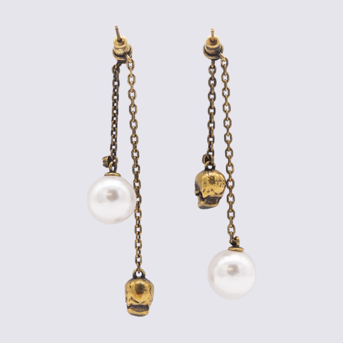 Shop Alexander Mcqueen Gold Tone Skull Metal Earrings In Mix