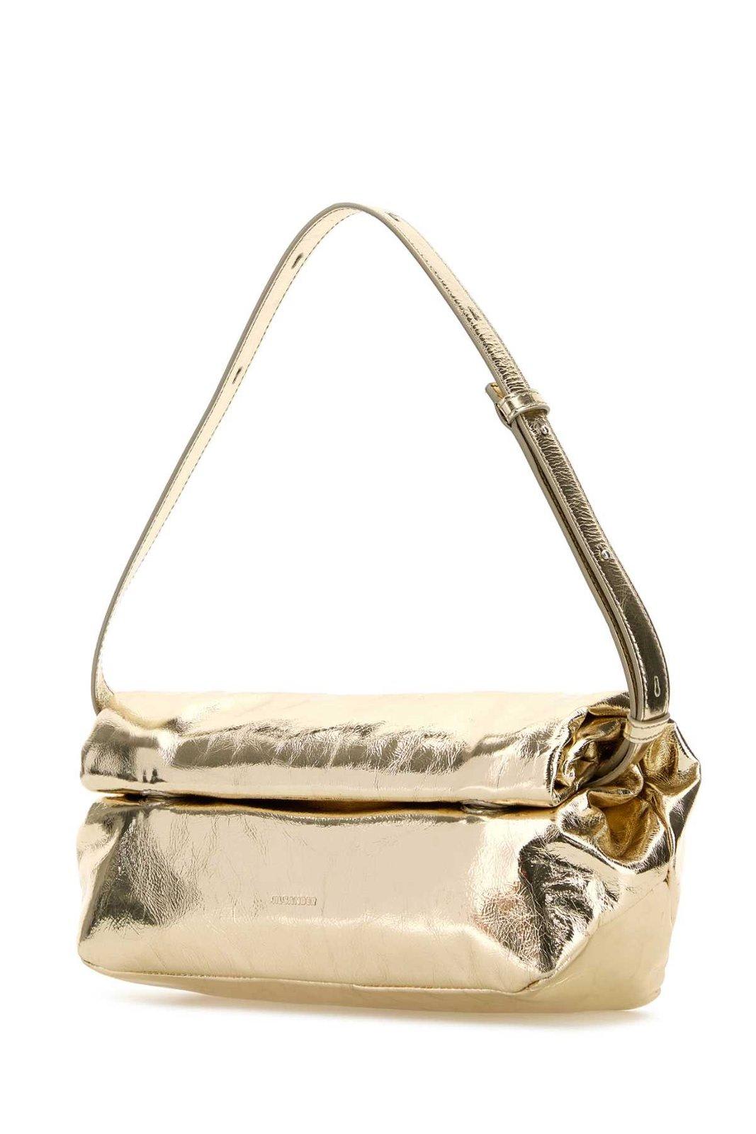 Shop Jil Sander Rollup Small Crossbody Bag In Oro