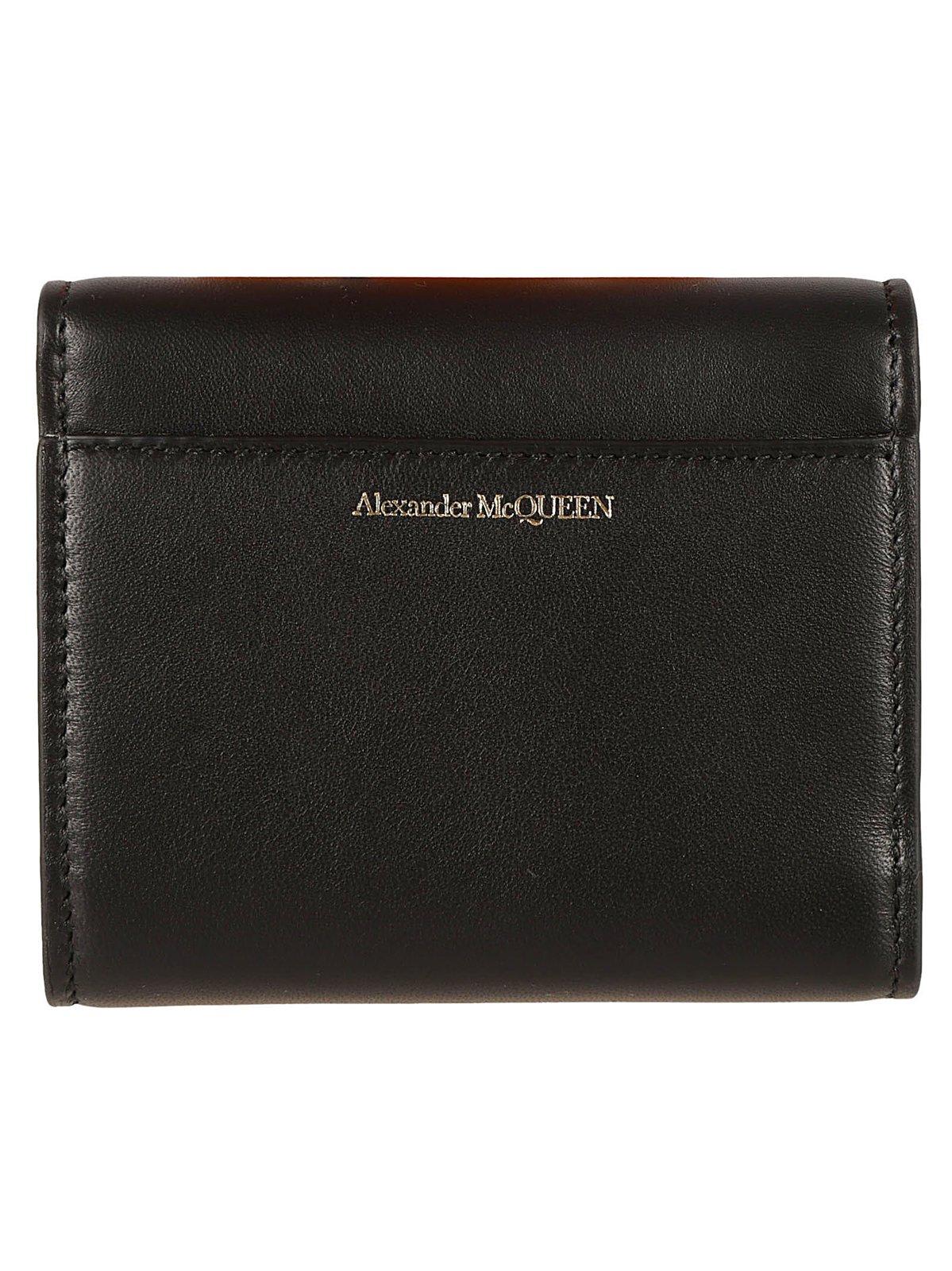 Shop Alexander Mcqueen The Seal Embossed Tri-fold Wallet In Black