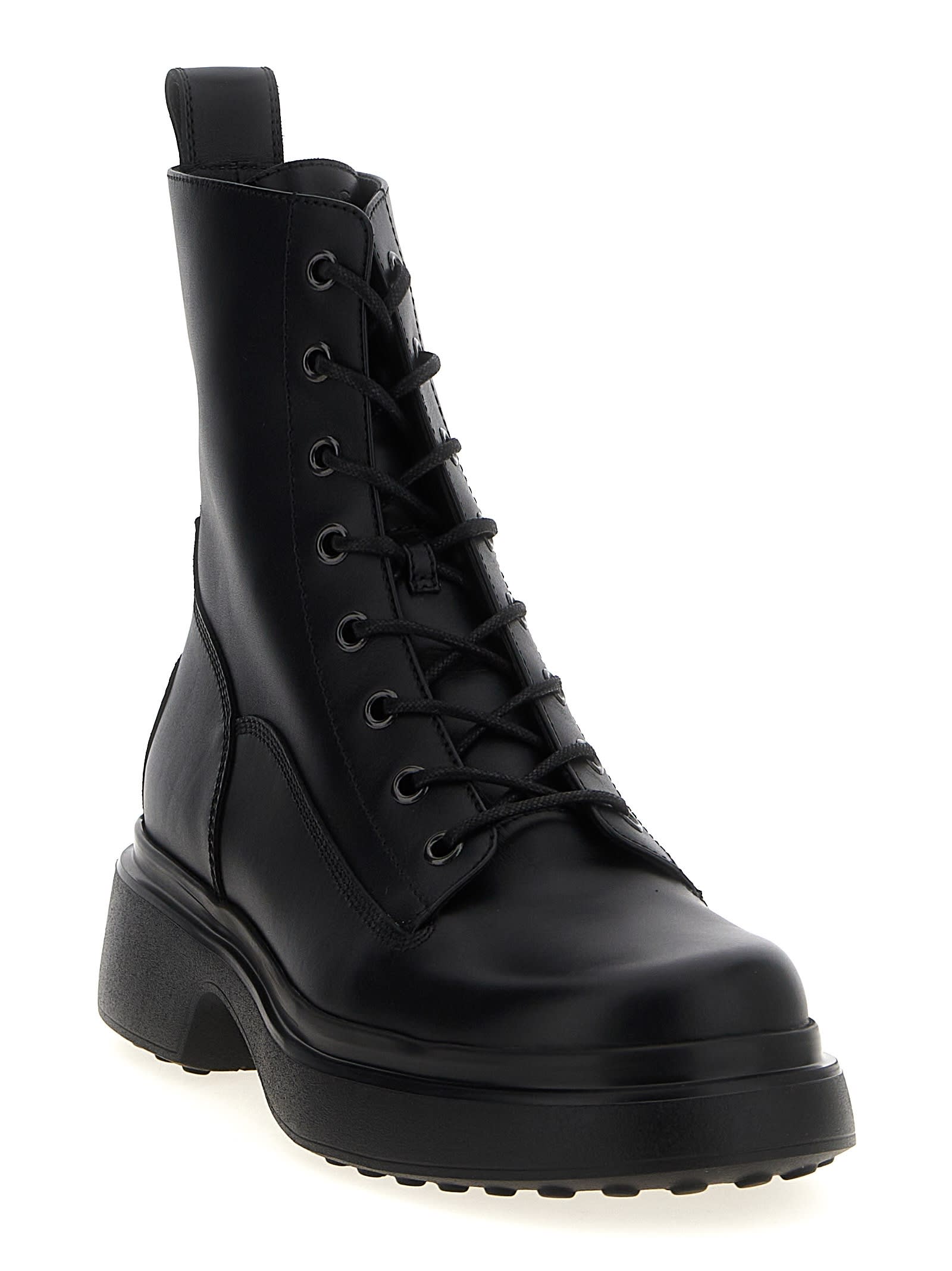 Tod's Chunky Sole Round Toe Ankle Boots With Pull Tab In Black