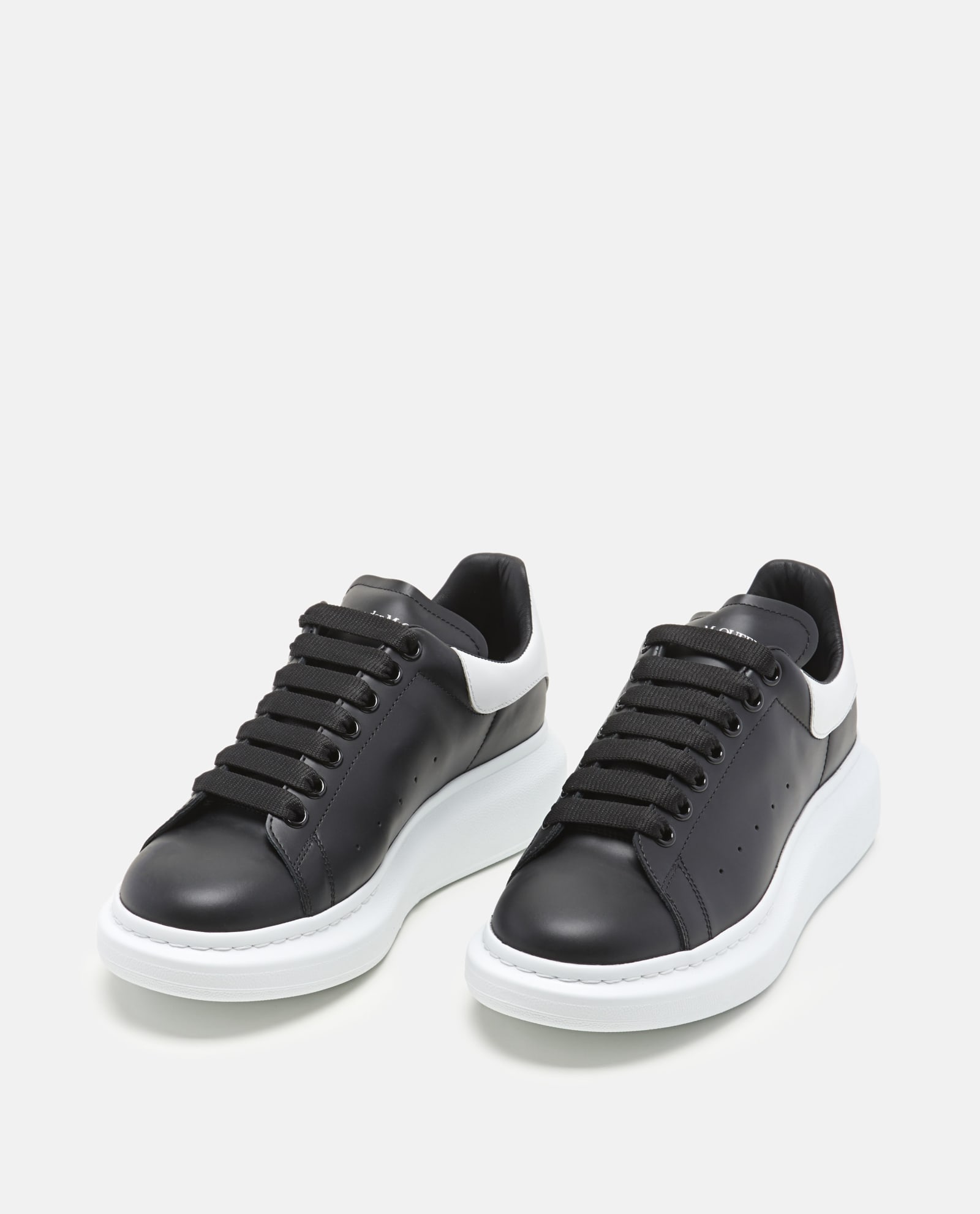 Shop Alexander Mcqueen Oversize Larry Leather Sneakers In Black