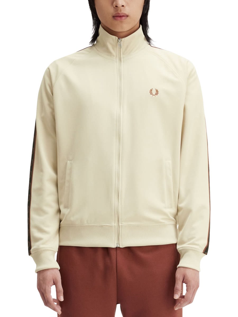 Shop Fred Perry Zip Sweatshirt. In Beige