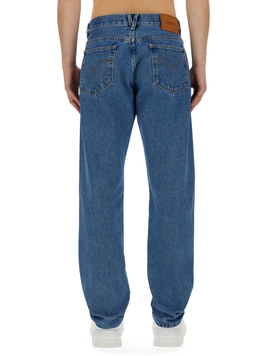 Shop Versace Regular Fit Jeans In Denim