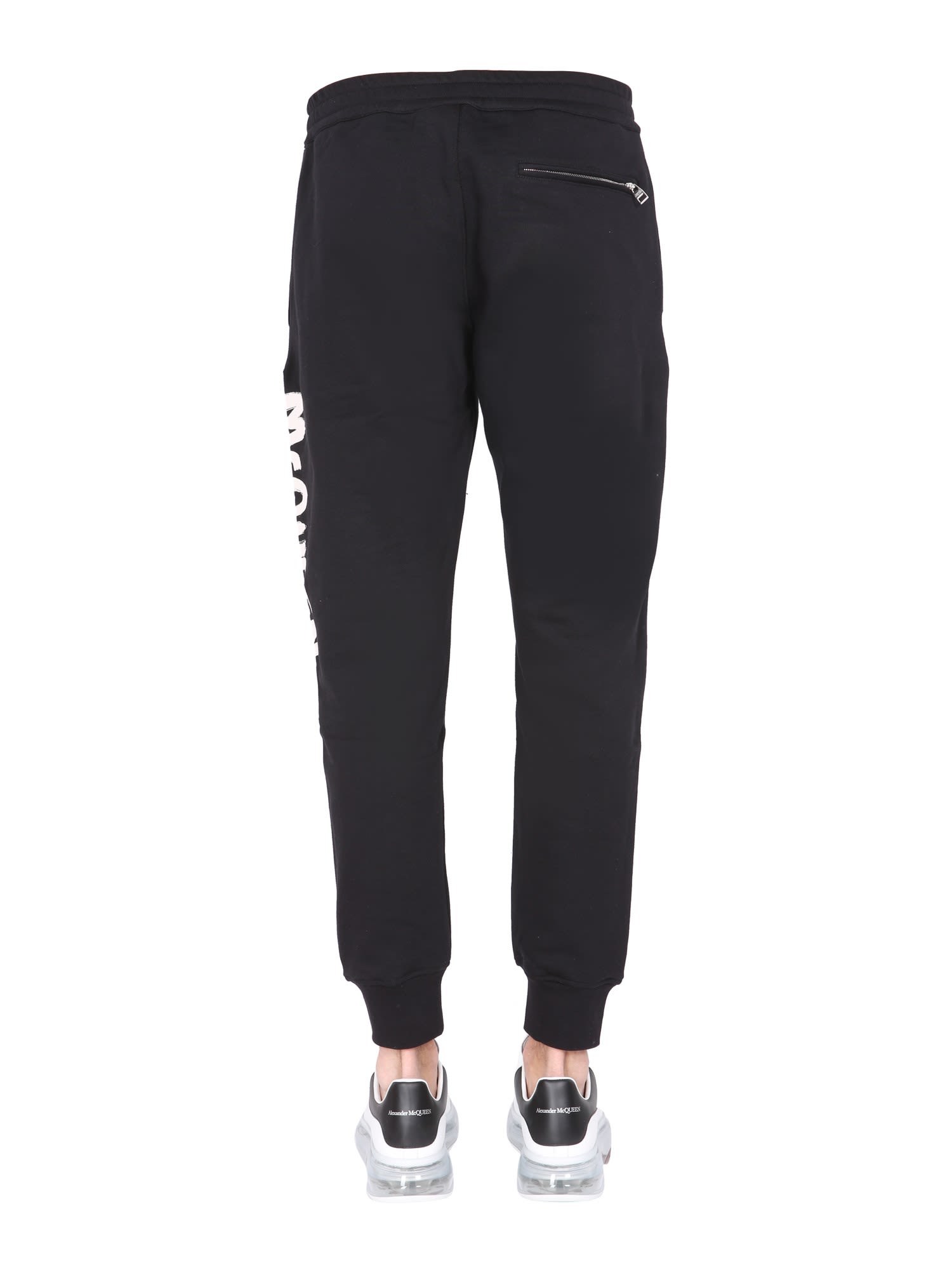 Shop Alexander Mcqueen Jogging Pants With Graffiti Logo In Black/ivory