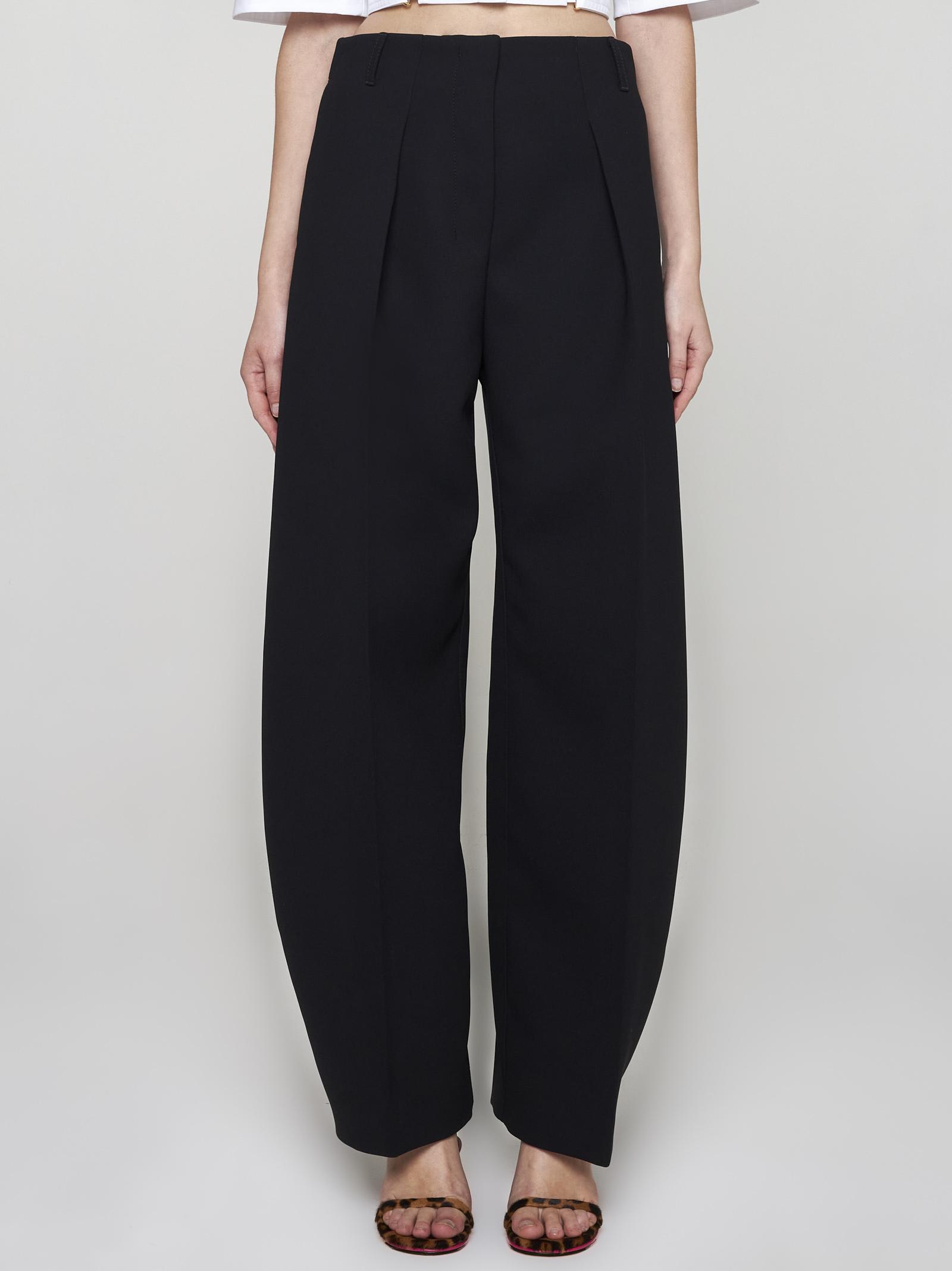 Shop Jacquemus Ovalo Trousers In Black