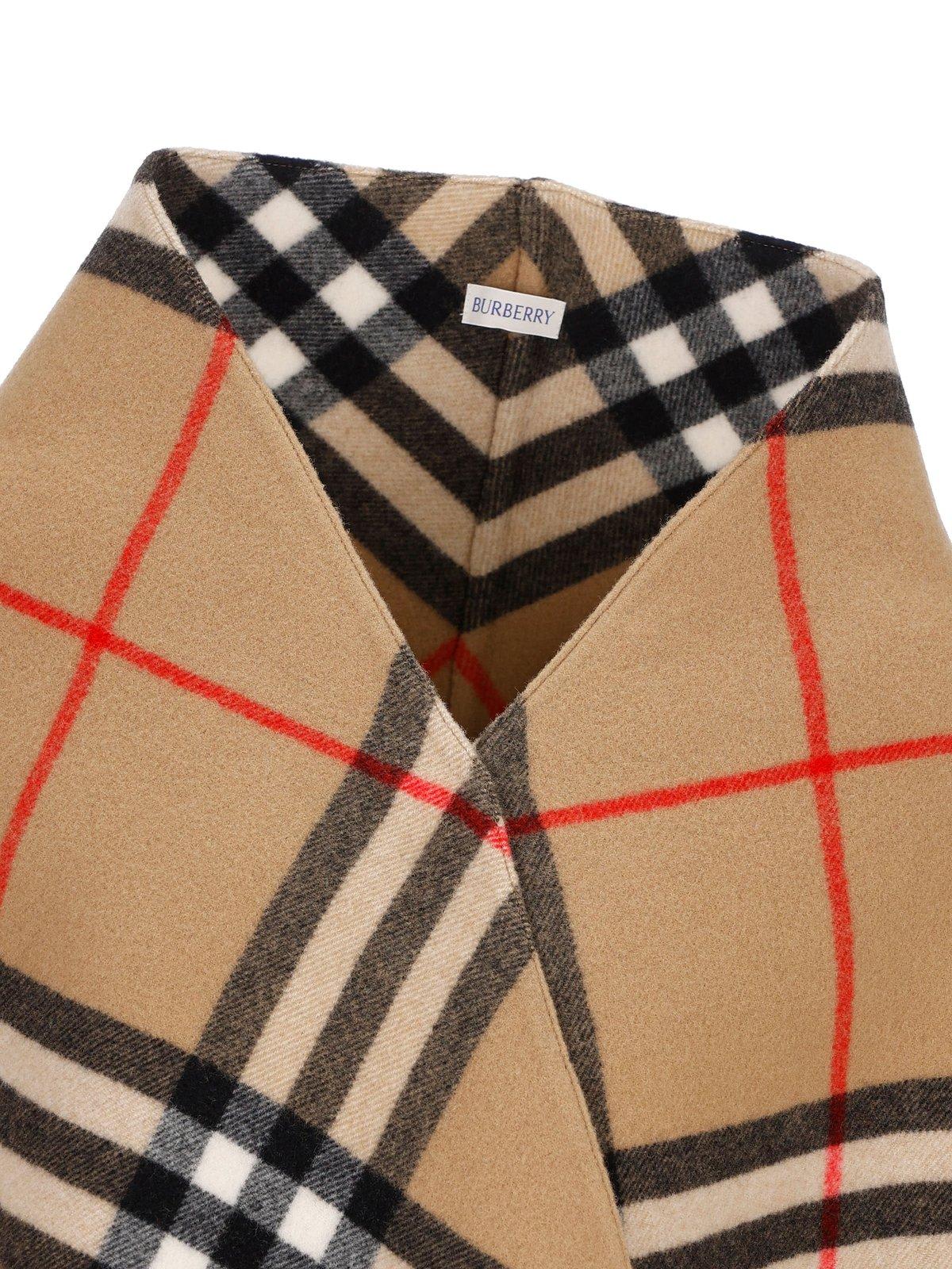 Shop Burberry Check Printed Fringed Cape In Beige