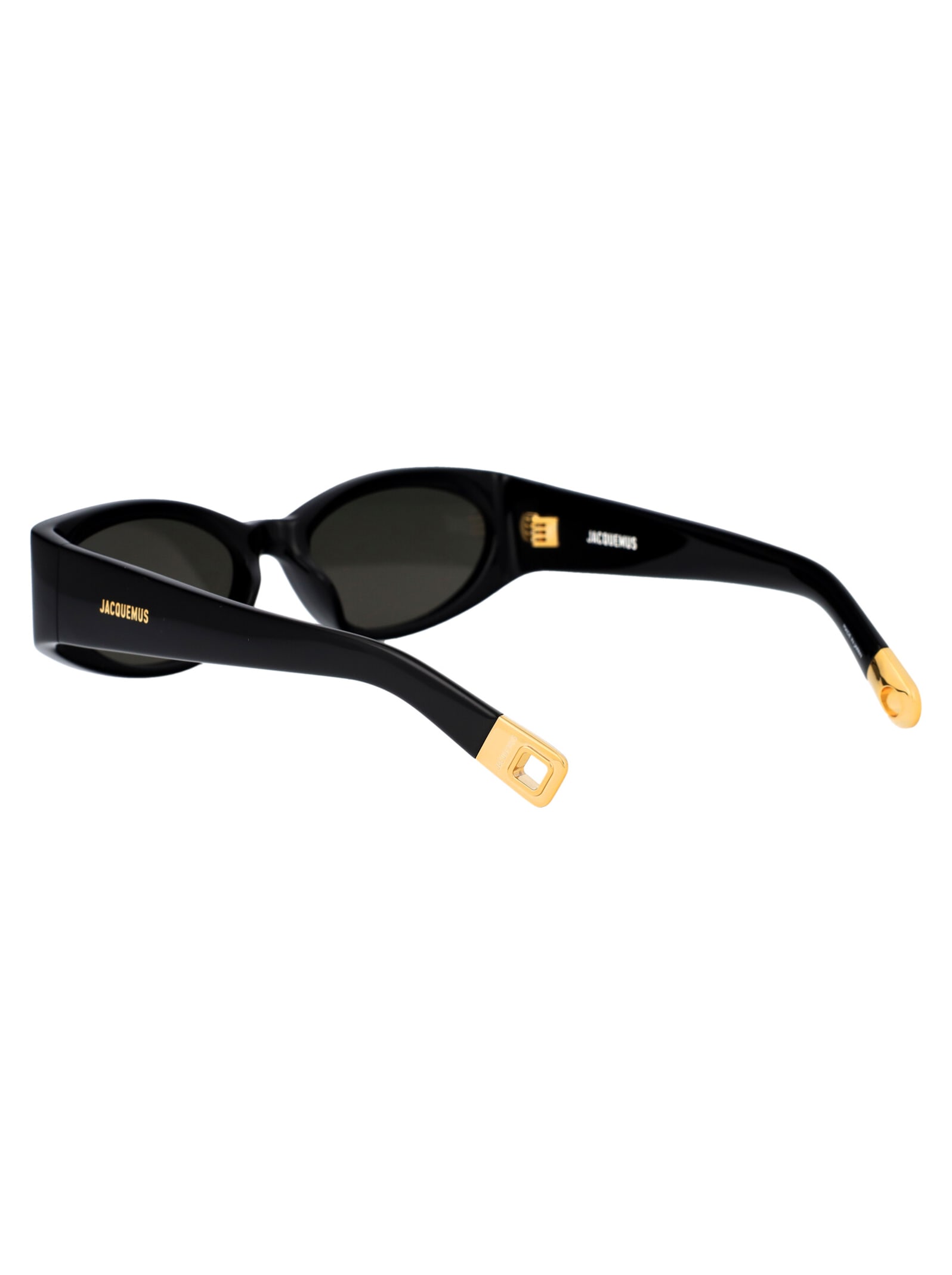 Shop Jacquemus Ovalo Sunglasses In 01 Black/ Yellow Gold/ Grey