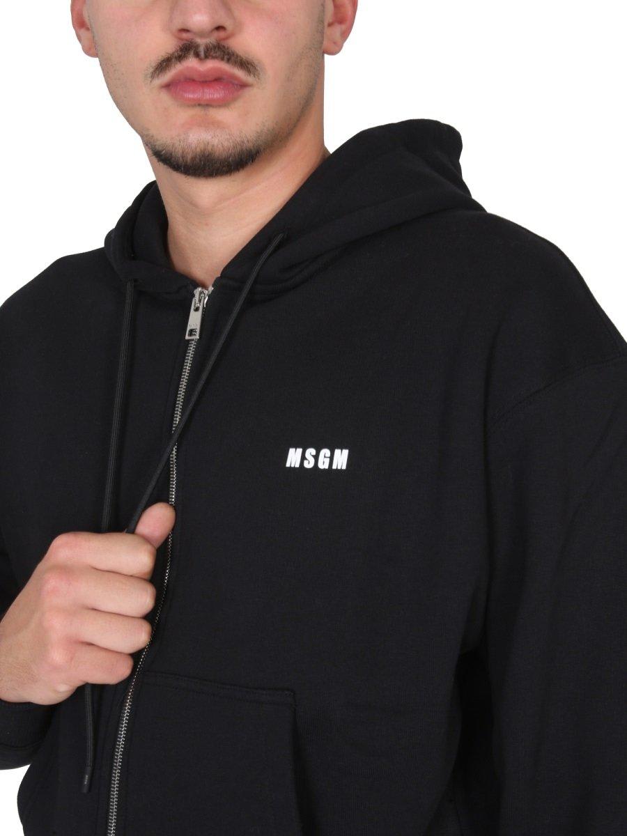 Shop Msgm Logo-printed Zipped Hoodie In Nero