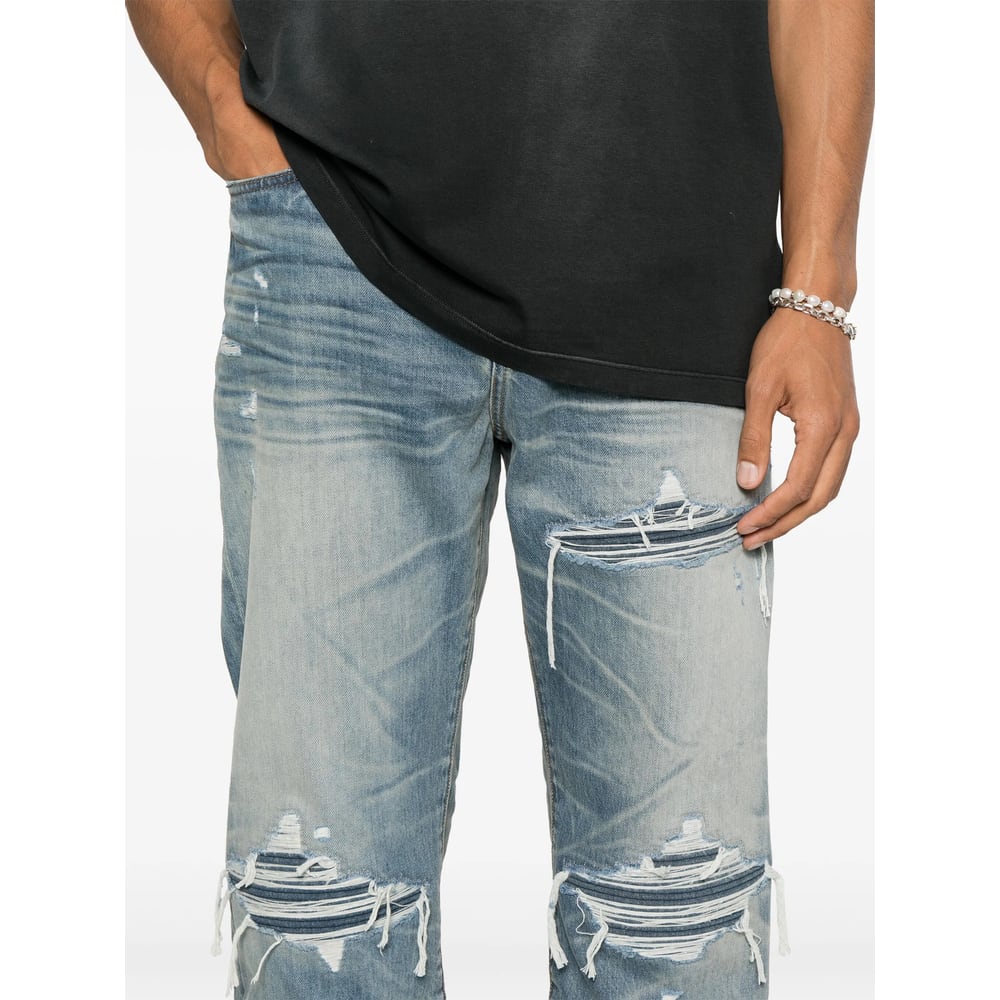 Amiri Men Blue Jeans With Ripped Details On The Front And Logo Patch On The Rear In Denim Man In Blue
