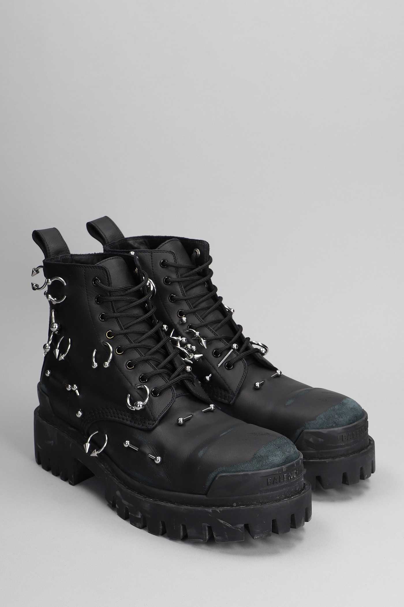 Shop Balenciaga Strike Piercing Combat Boots In Black Leather