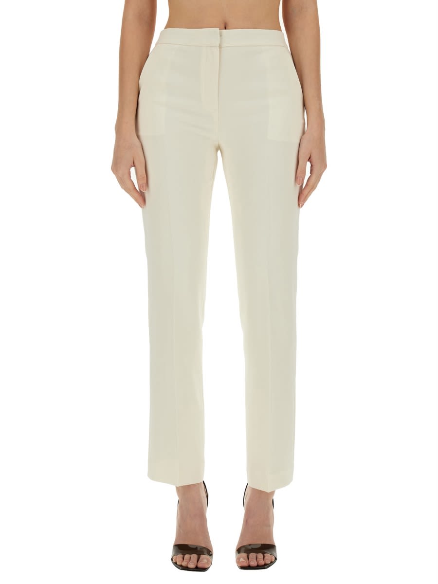 Shop Theory Slim Fit Pants In Ivory