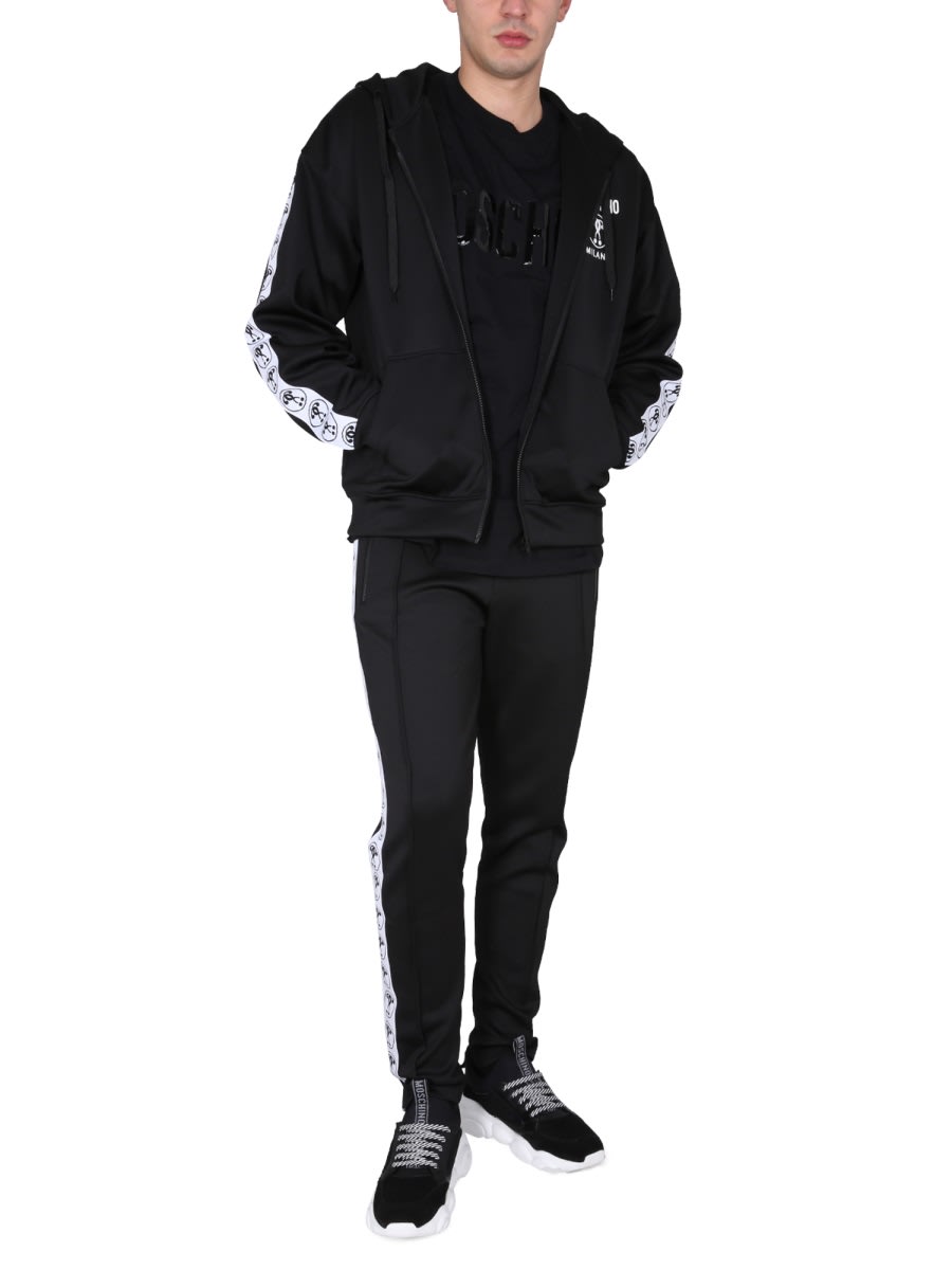 Moschino Jogging Pants With Adjustable Drawstring And Zippered Pockets In Black