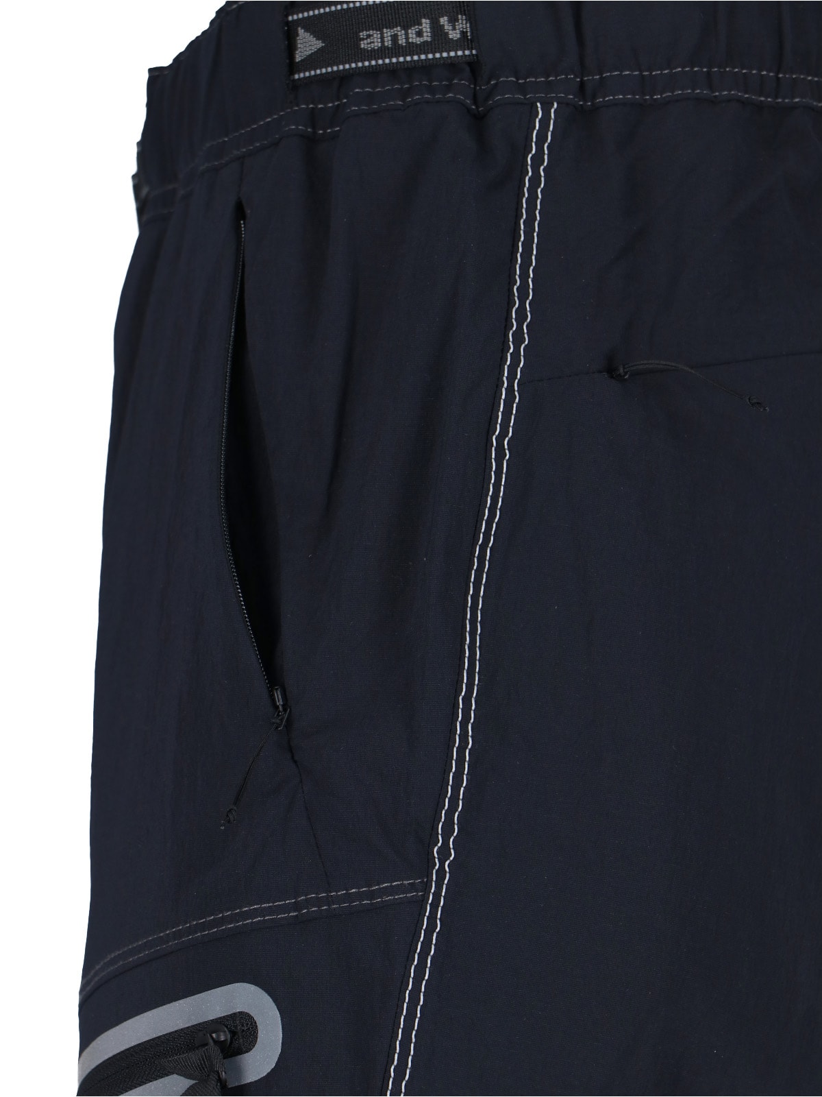 And Wander Streamlined Black Trousers With Zippered Pockets